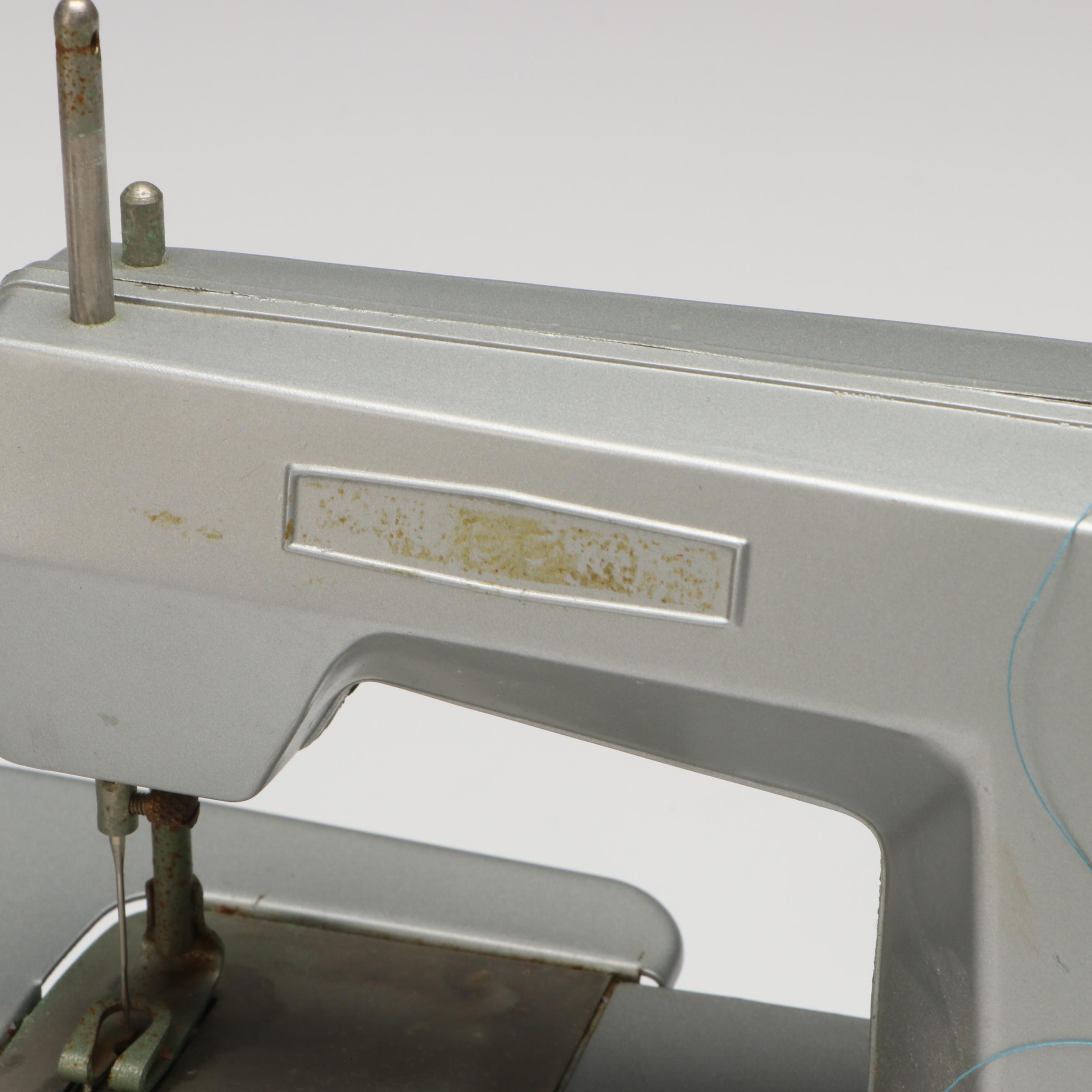 Vulcan Battery Powered Sewing Machine with Tin of Buttons and Pincushion