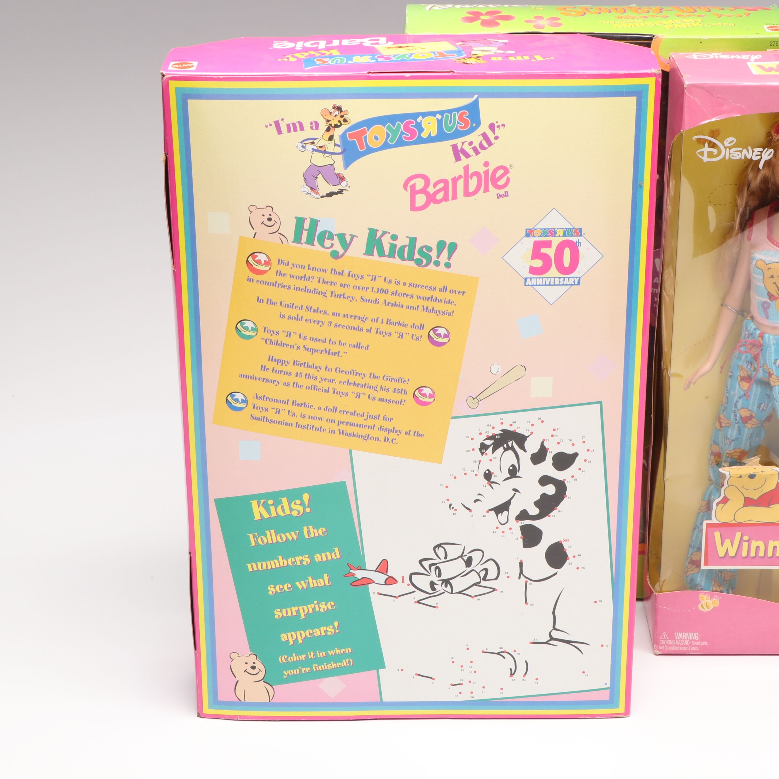 Barbie "Winnie the Pooh" Doll with Other Barbie Dolls