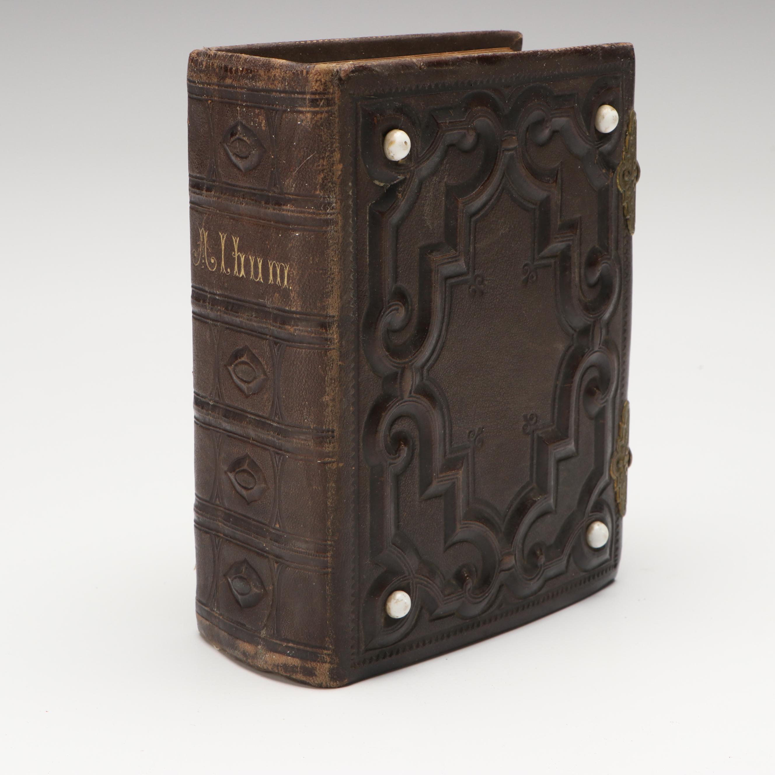 Portraits of Men, Women and Children in Embossed Leather Album