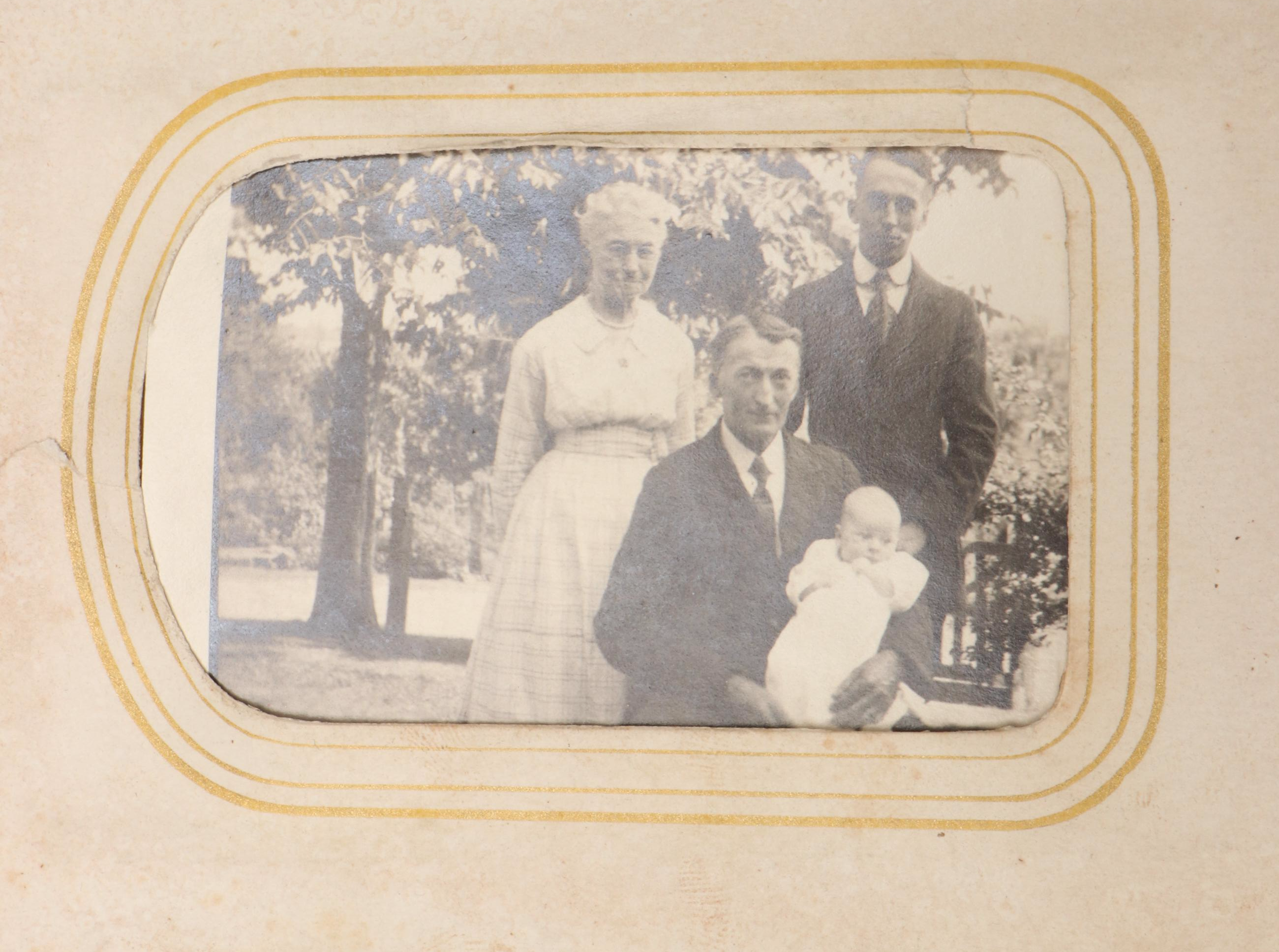 Portraits of Men, Women and Children in Embossed Leather Album