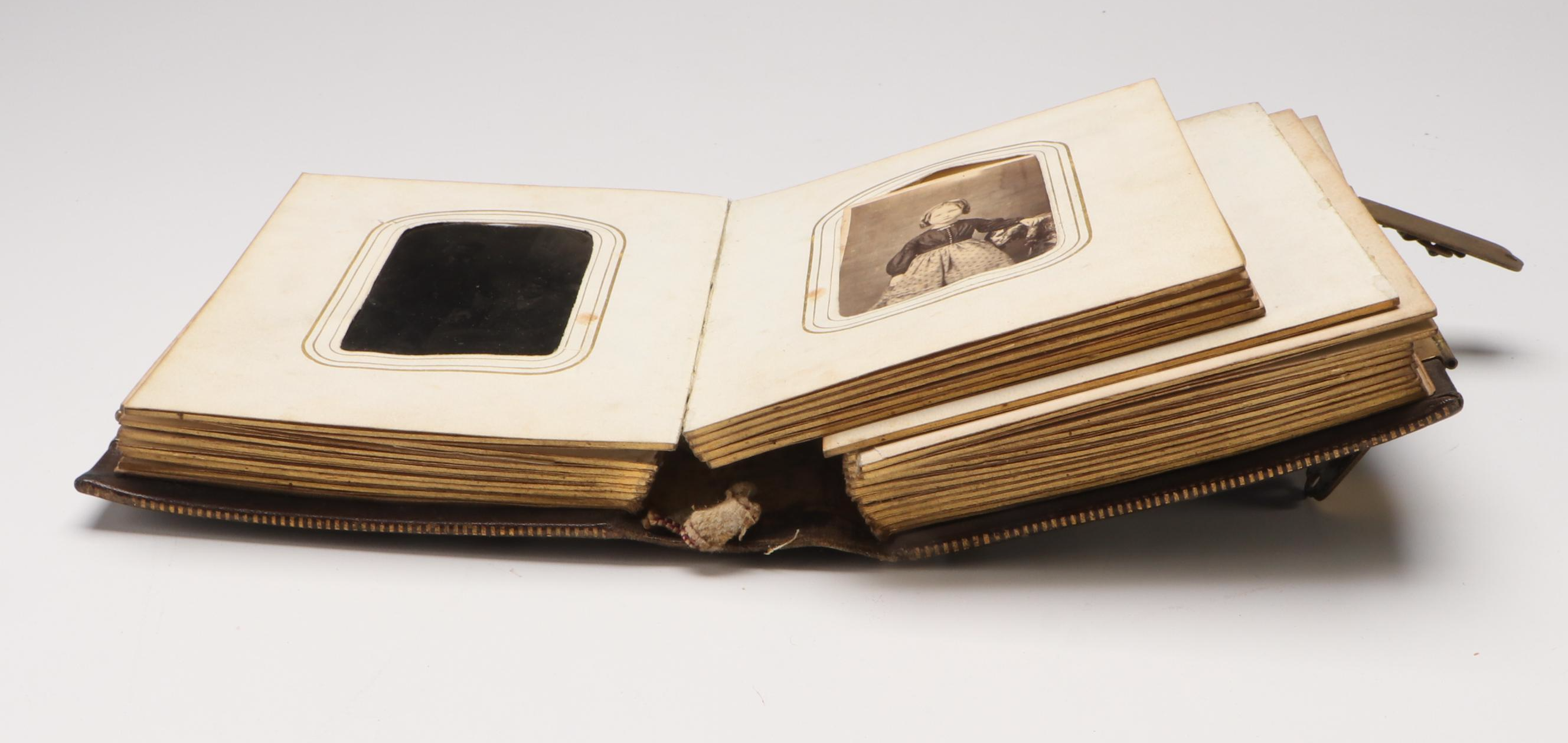 Portraits of Men, Women and Children in Embossed Leather Album