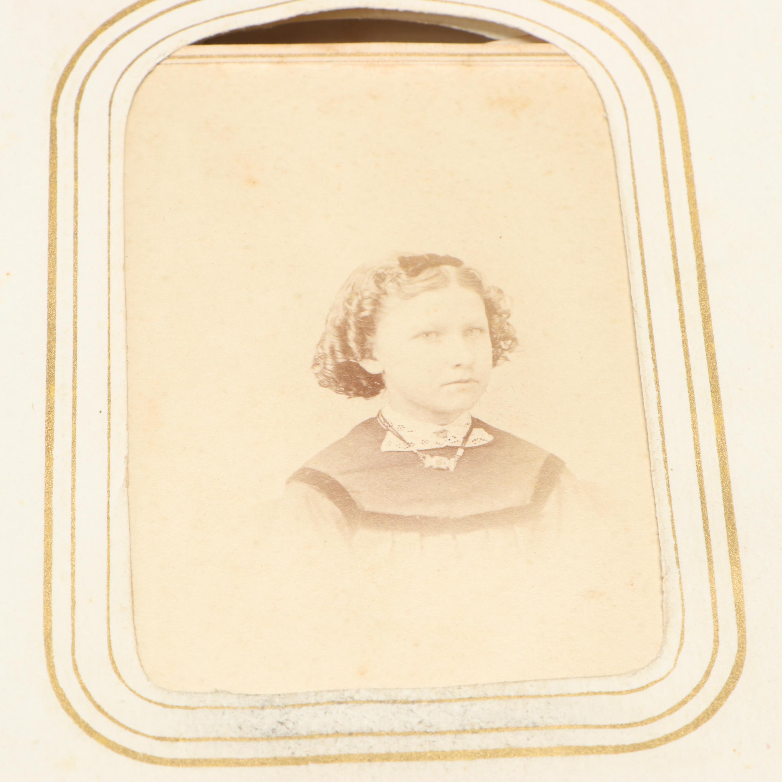 Portraits of Men, Women and Children in Embossed Leather Album