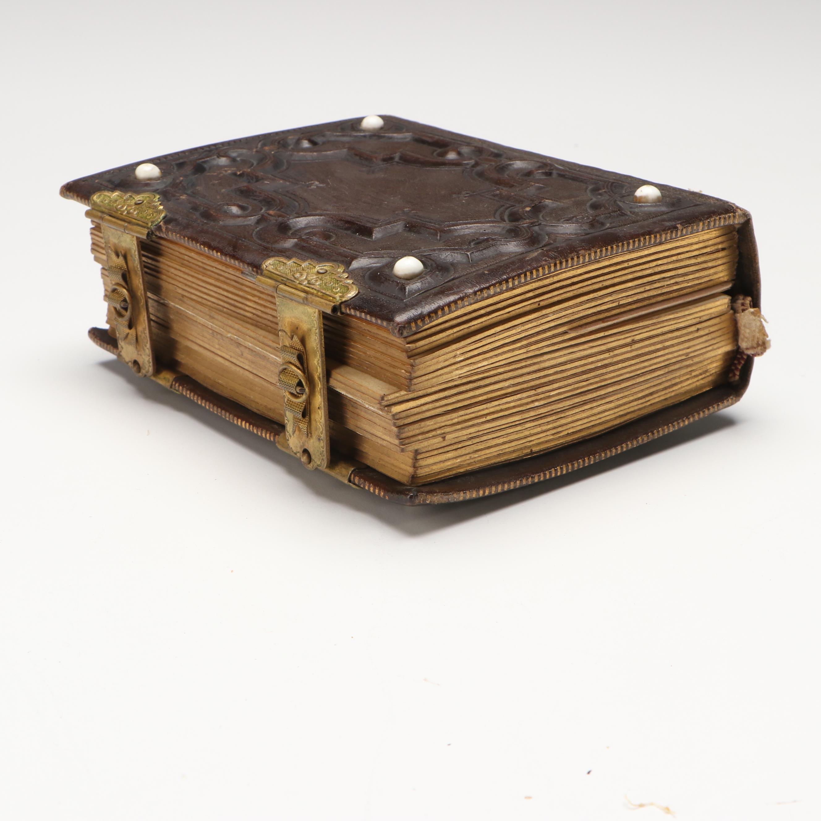 Portraits of Men, Women and Children in Embossed Leather Album