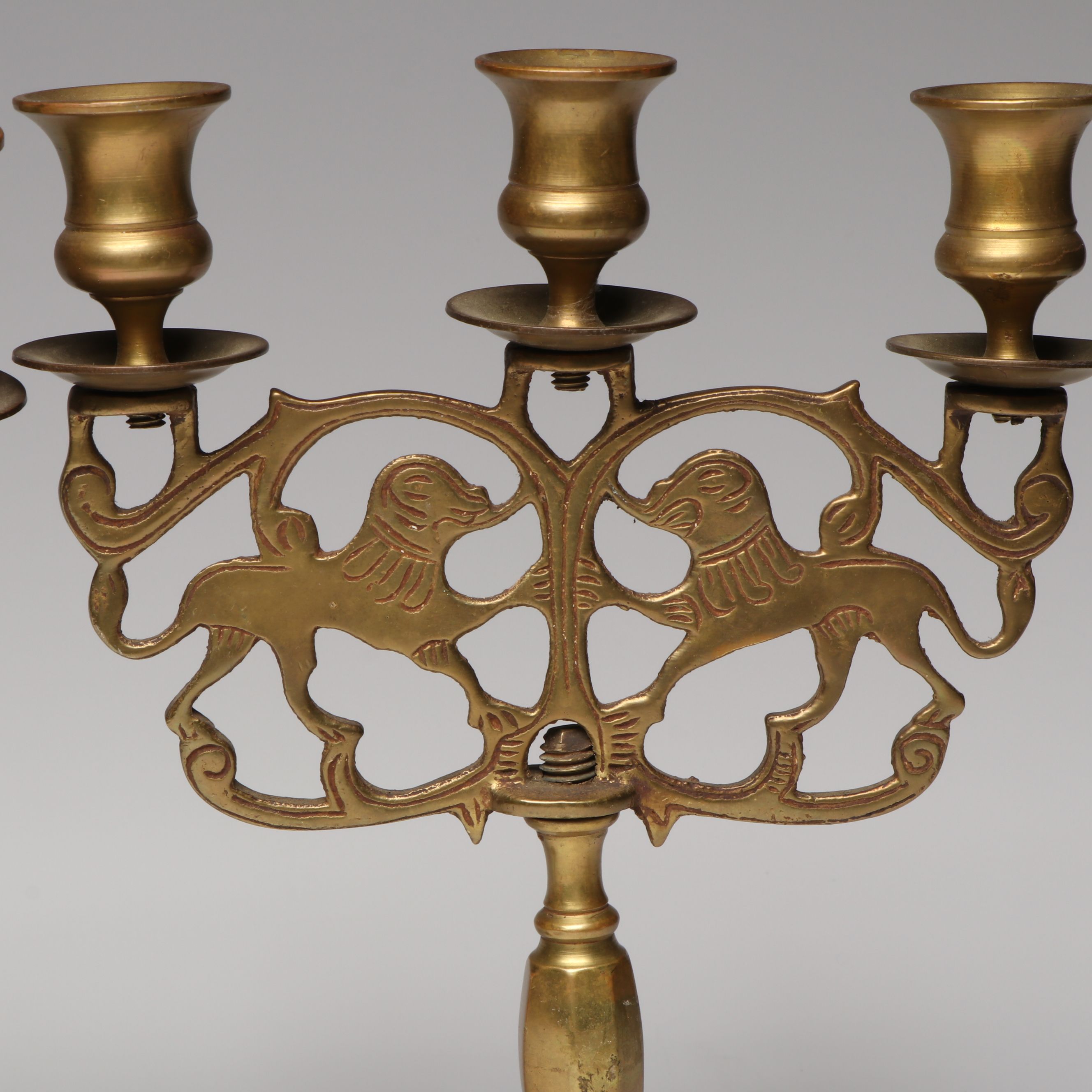 Pair of Lions of Judah Candelabra with Indian and Other Brass Candlesticks