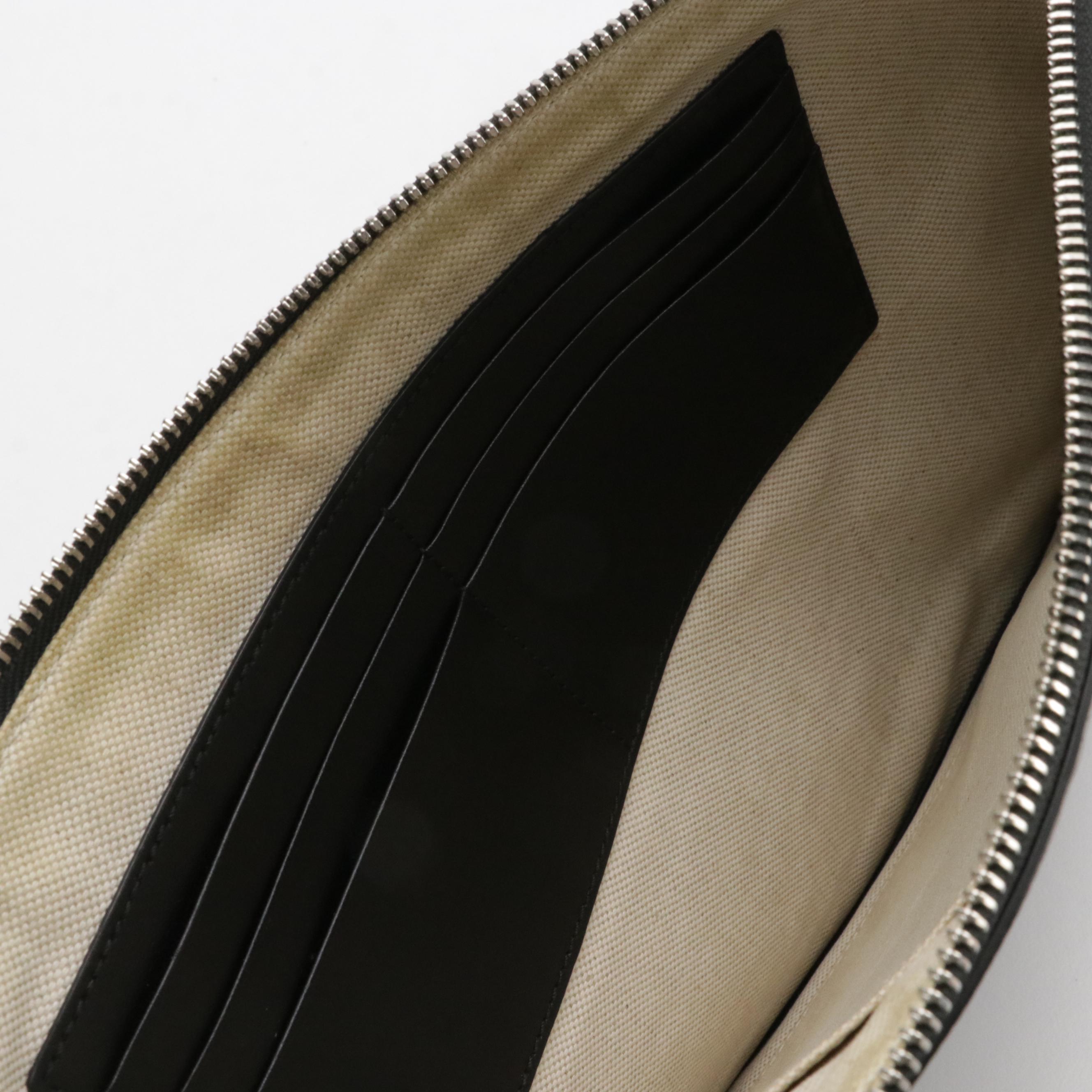 Gucci Zip Wristlet Clutch in Black Perforated GG Embossed Leather