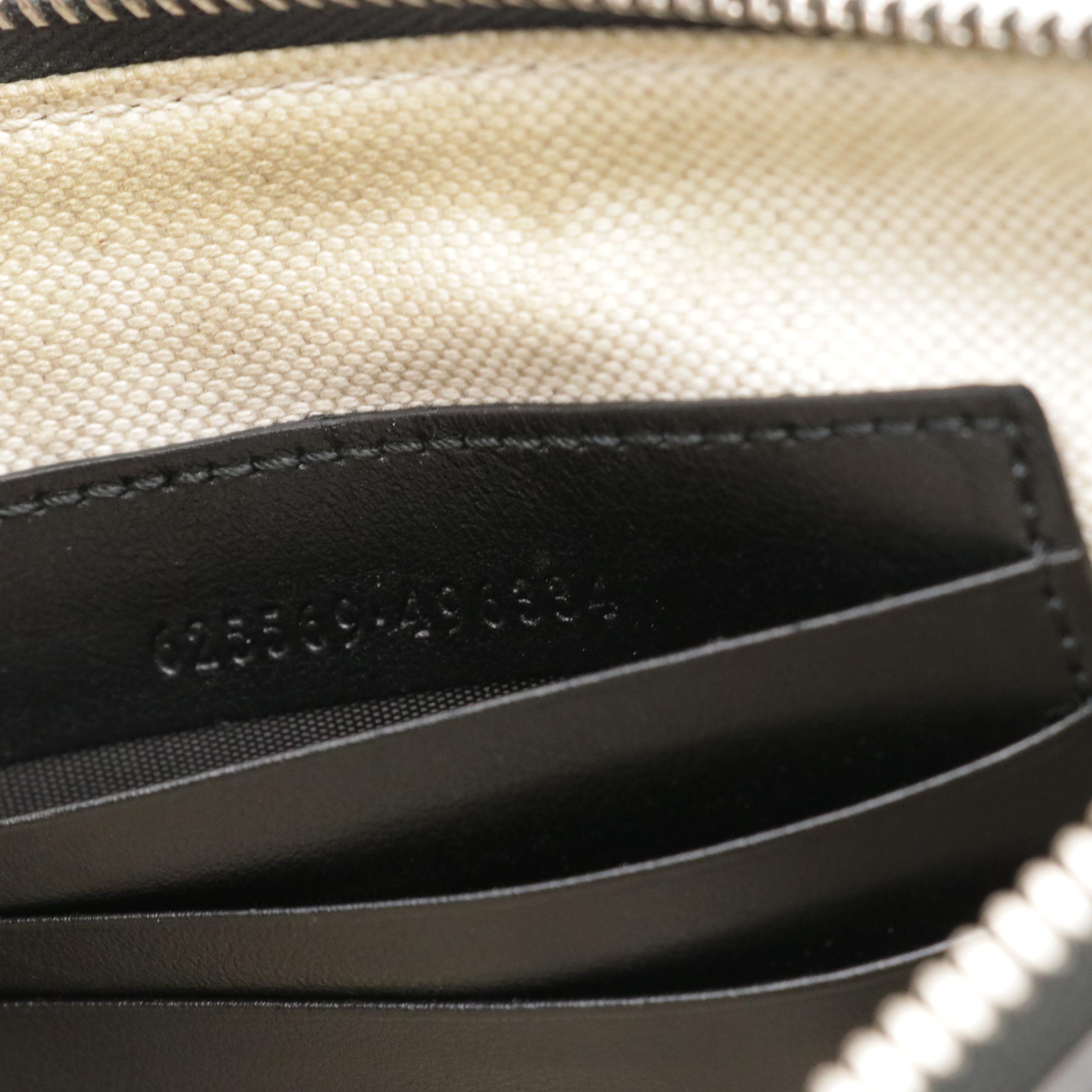 Gucci Zip Wristlet Clutch in Black Perforated GG Embossed Leather