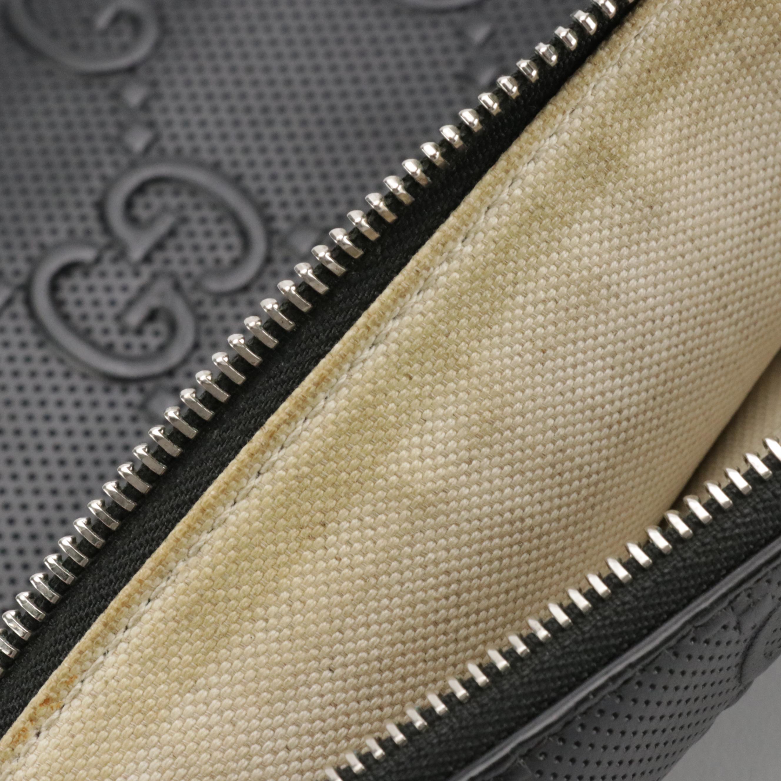 Gucci Zip Wristlet Clutch in Black Perforated GG Embossed Leather