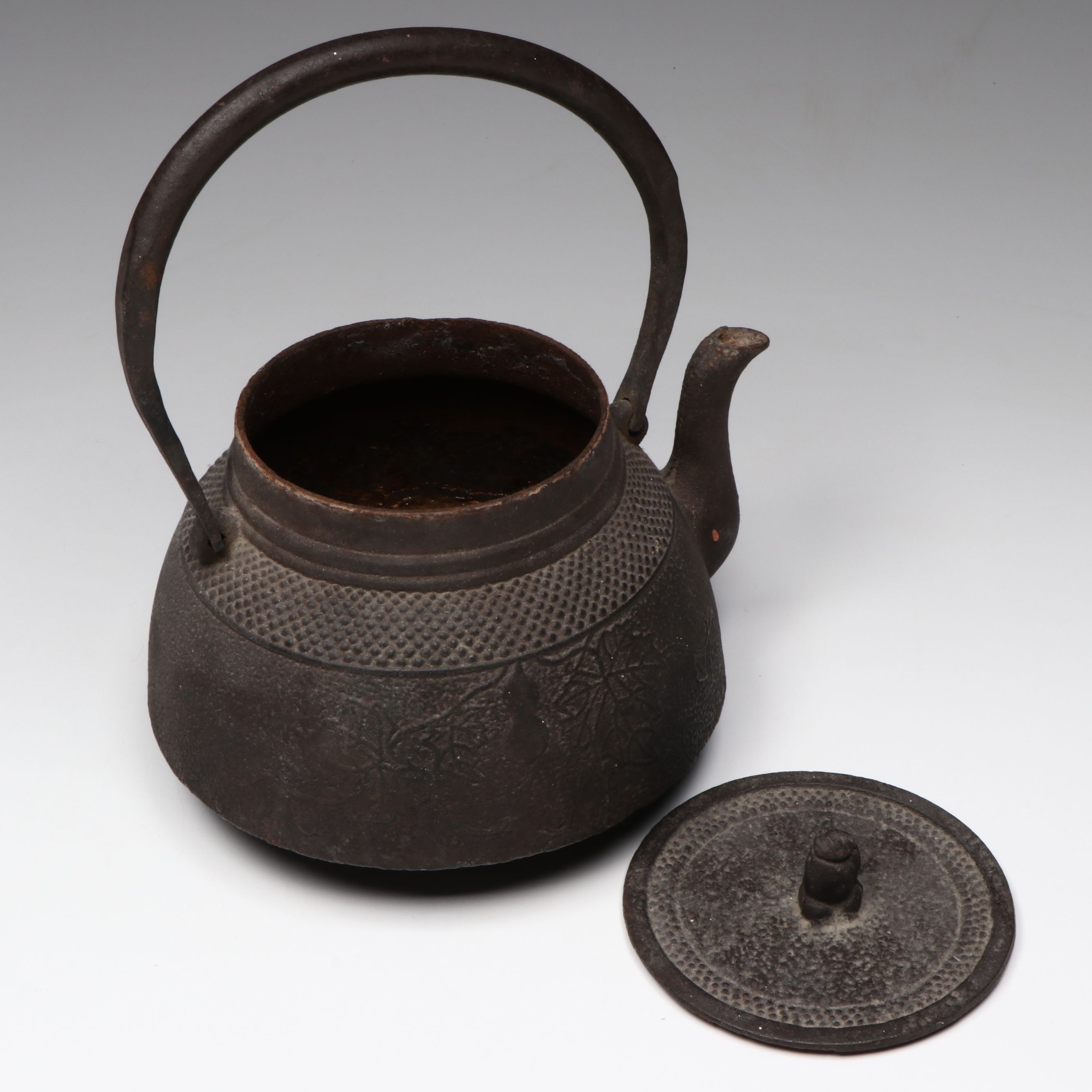 Cast Iron Teapot with Porcelain Cups and Wood Stand