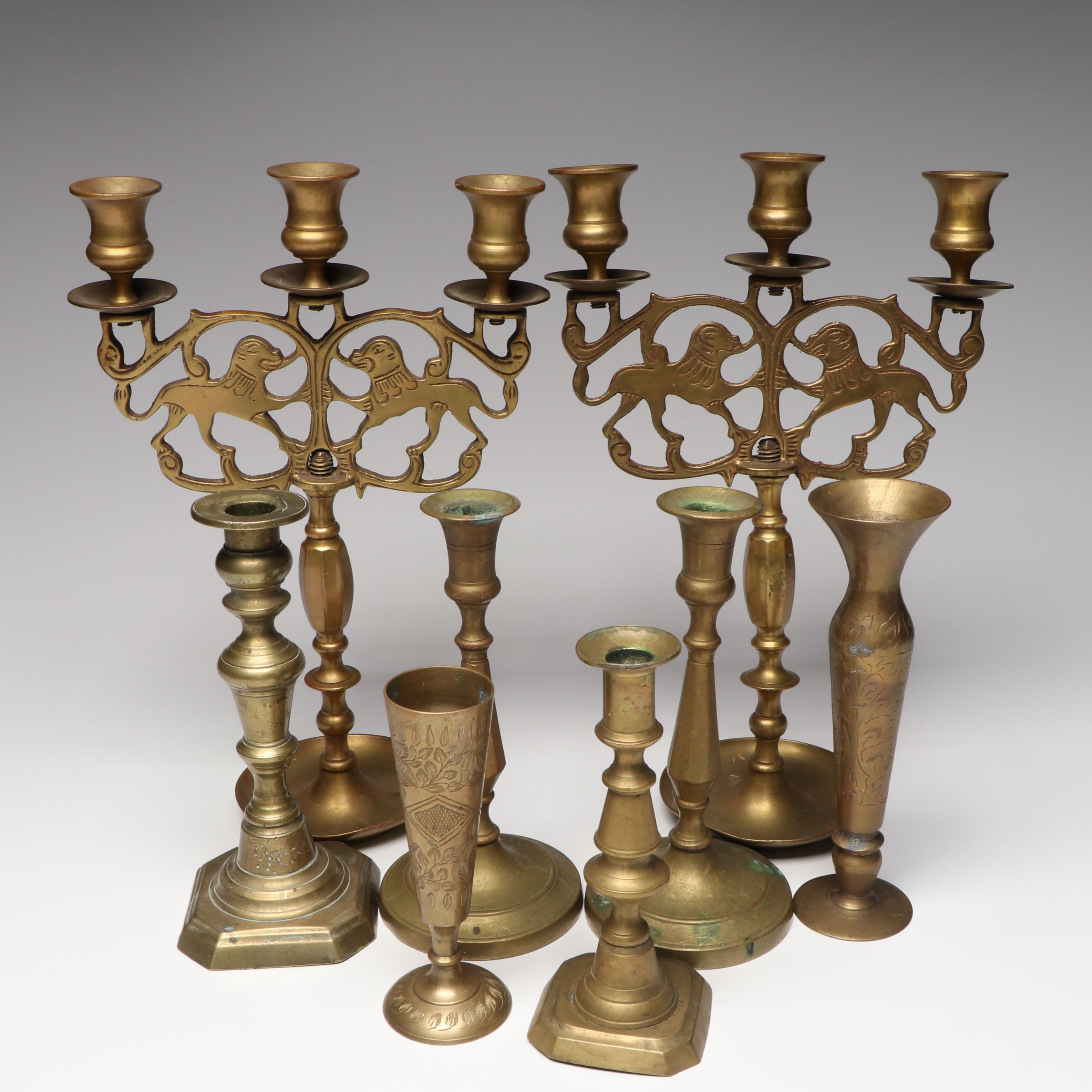 Pair of Lions of Judah Candelabra with Indian and Other Brass Candlesticks