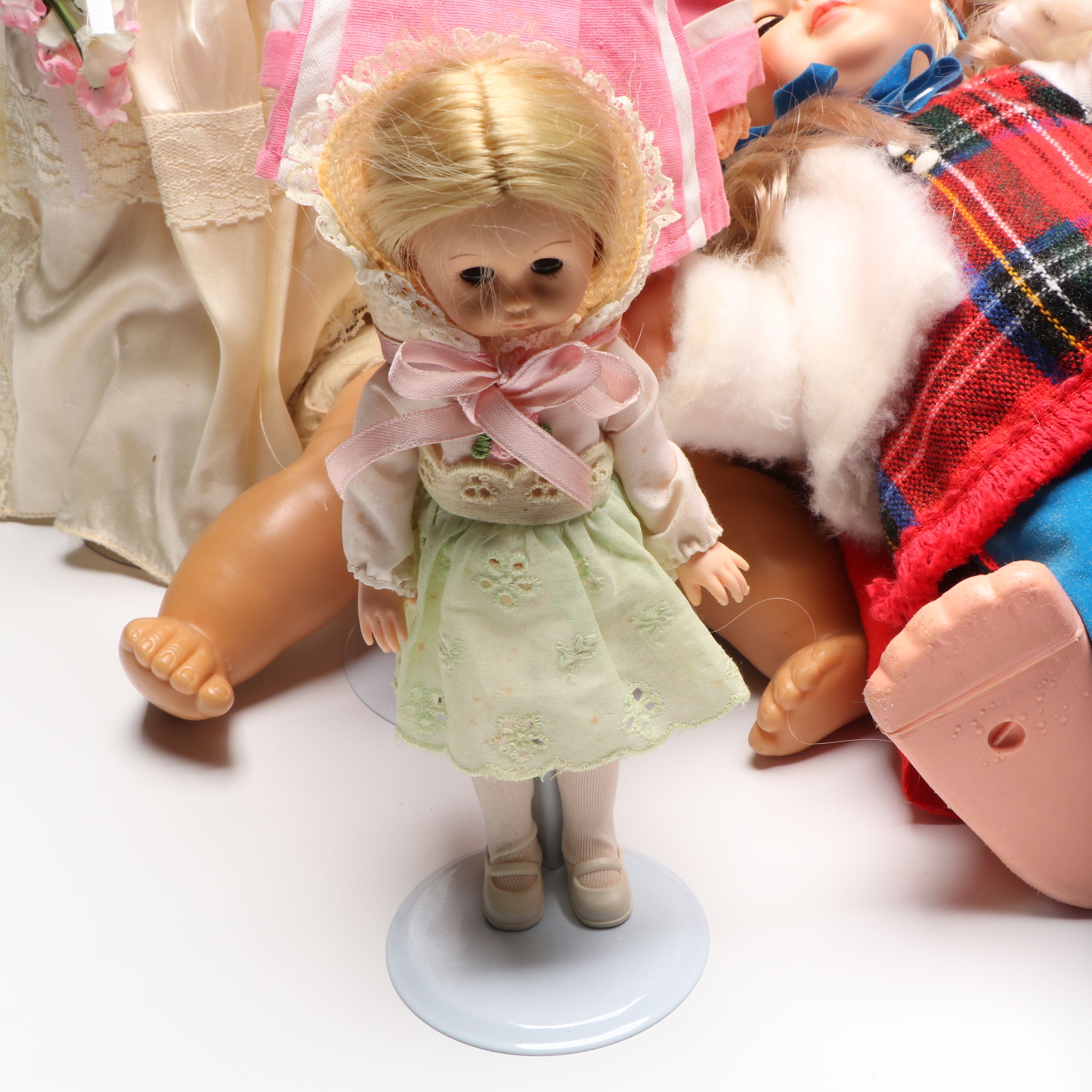 Vogue Ginny and Other Plastic Dolls with Clothing and Cradle, 1970s