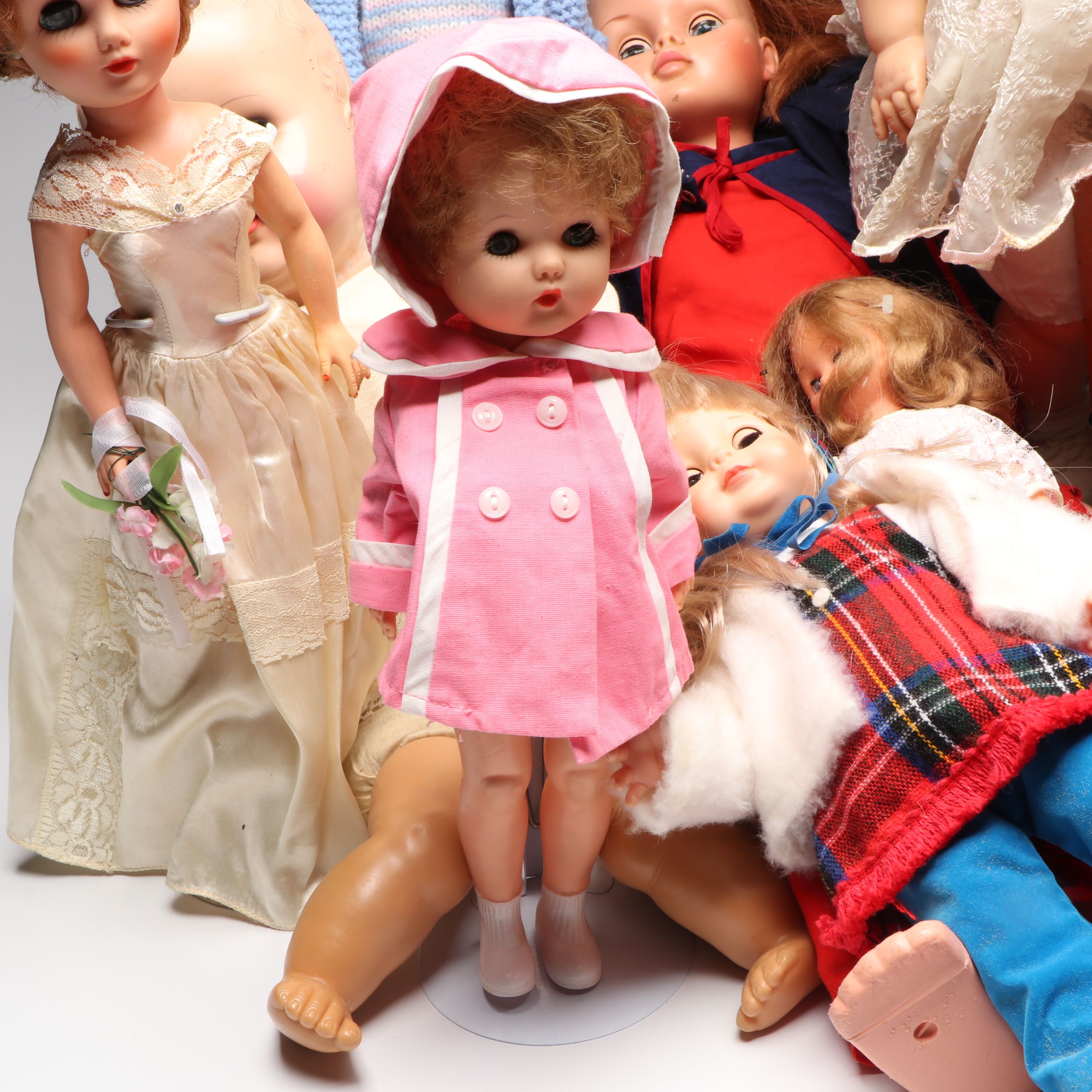 Vogue Ginny and Other Plastic Dolls with Clothing and Cradle, 1970s