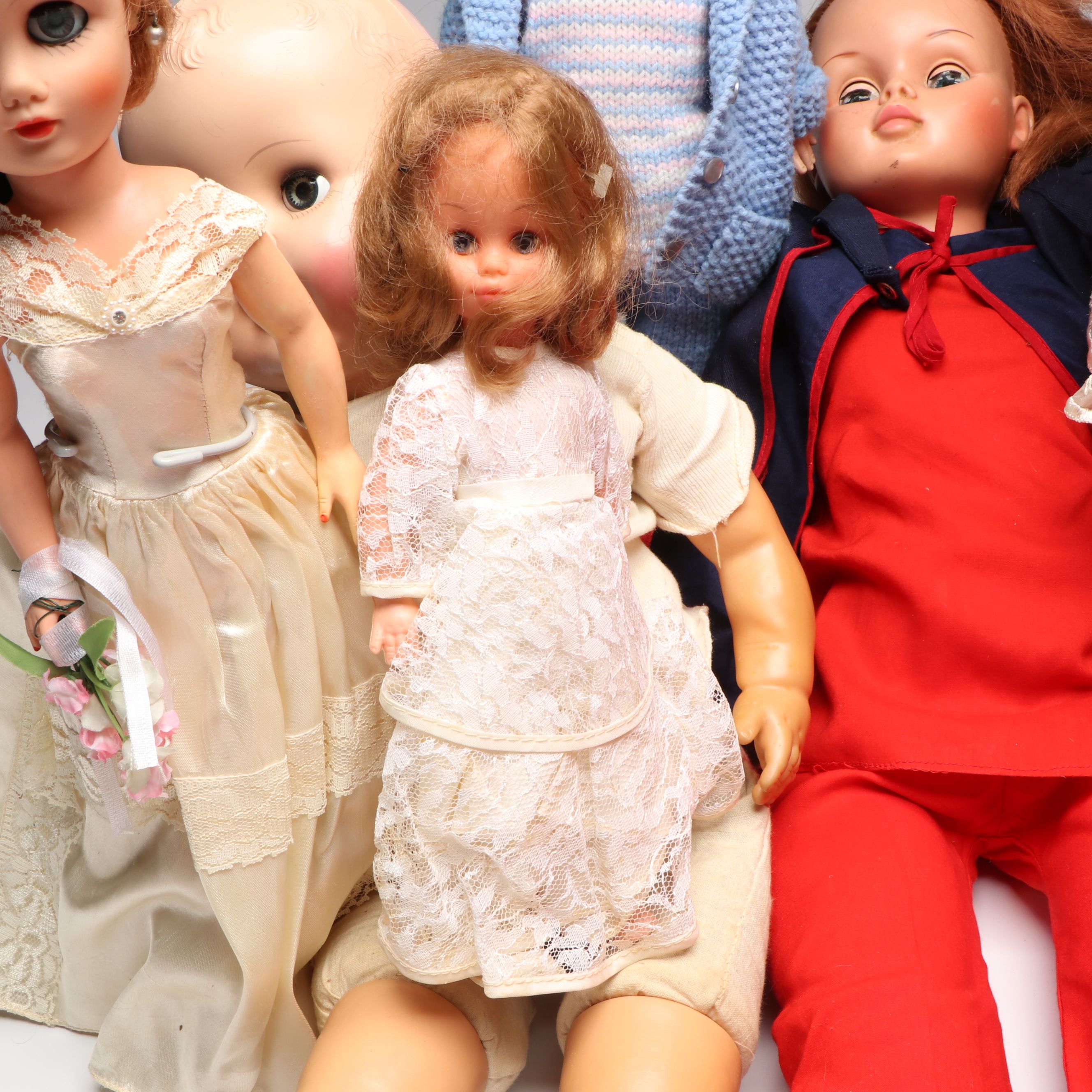 Vogue Ginny and Other Plastic Dolls with Clothing and Cradle, 1970s