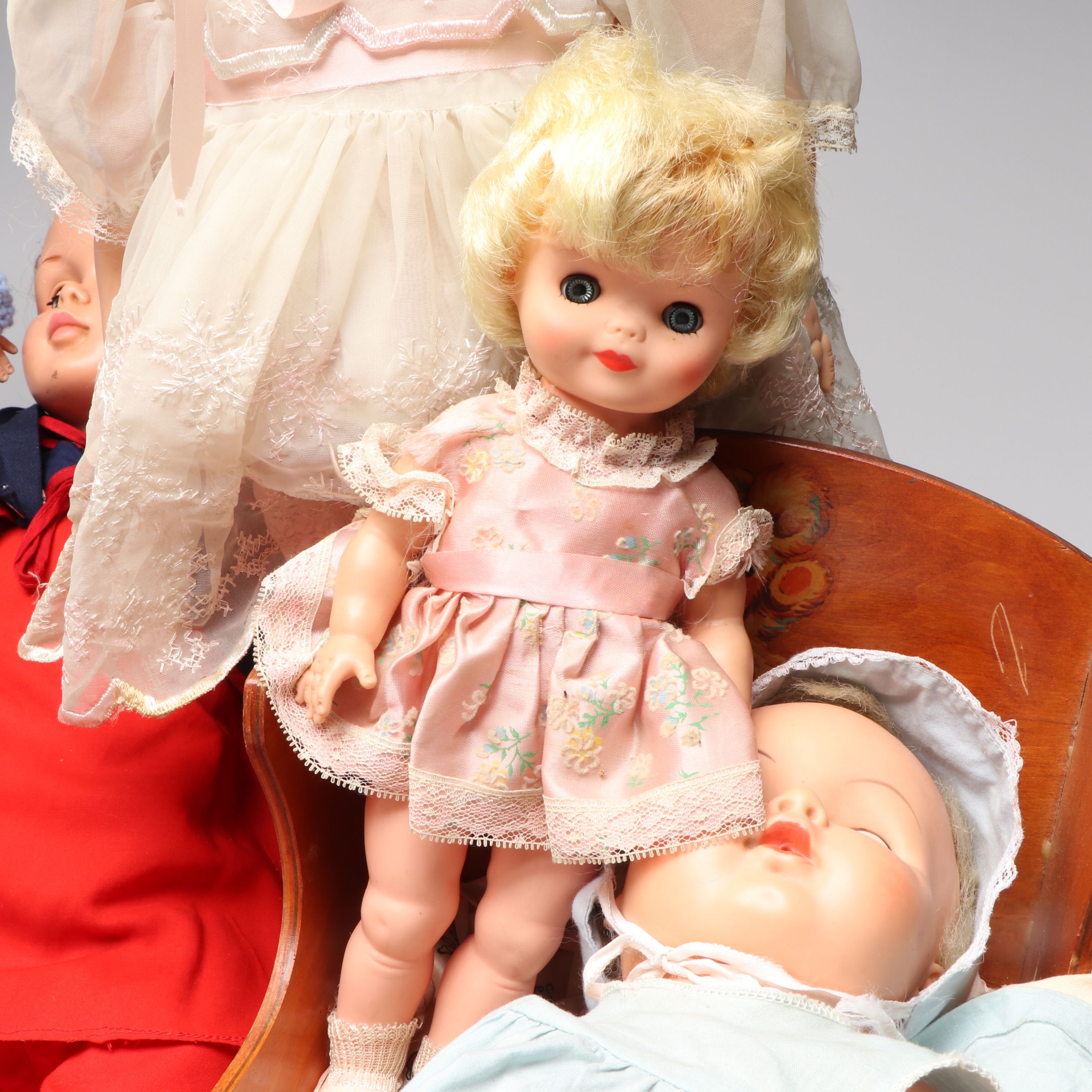 Vogue Ginny and Other Plastic Dolls with Clothing and Cradle, 1970s