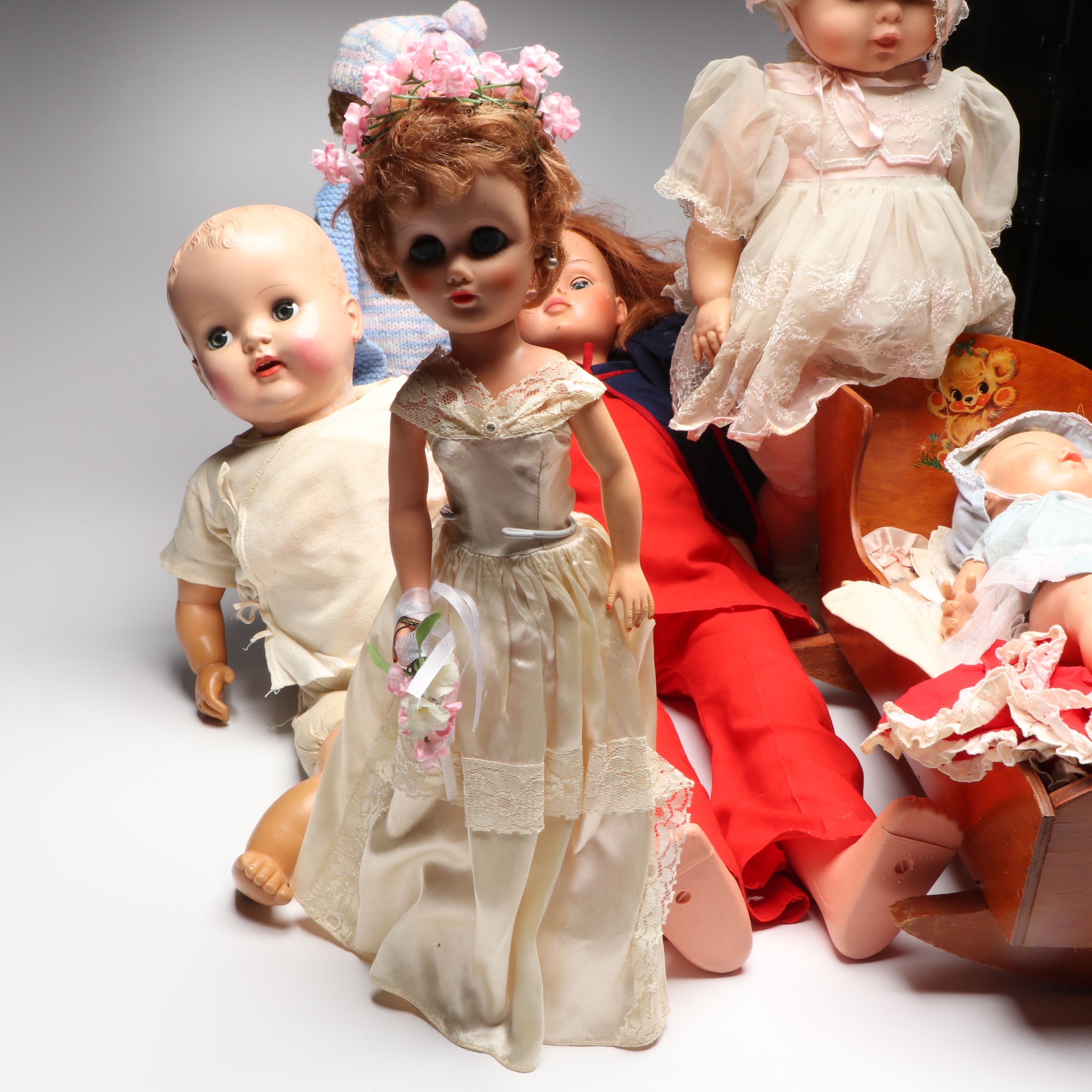 Vogue Ginny and Other Plastic Dolls with Clothing and Cradle, 1970s