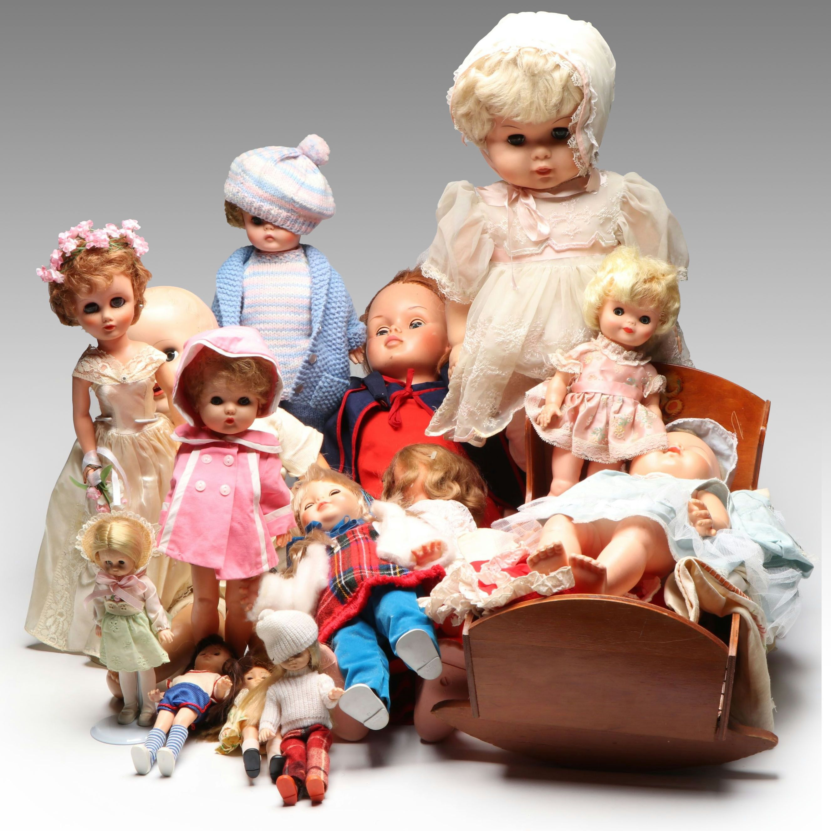 Vogue Ginny and Other Plastic Dolls with Clothing and Cradle, 1970s