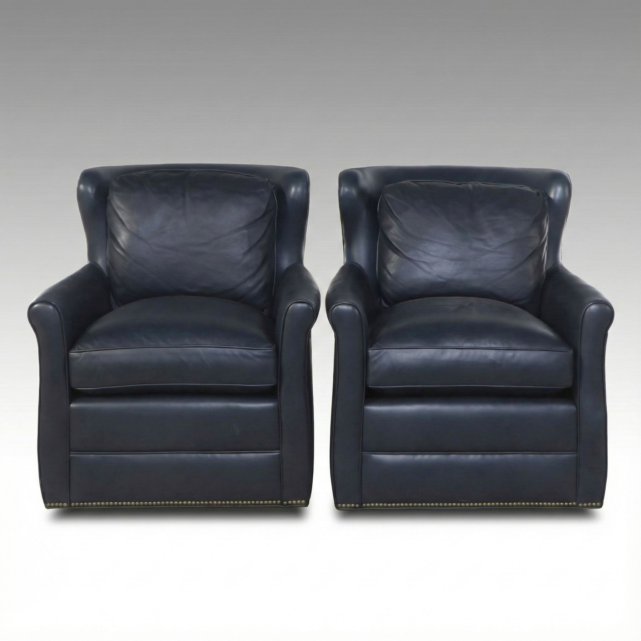 Pair of Ohio Hardwood Furniture Leather Upholstered Swivel Armchairs