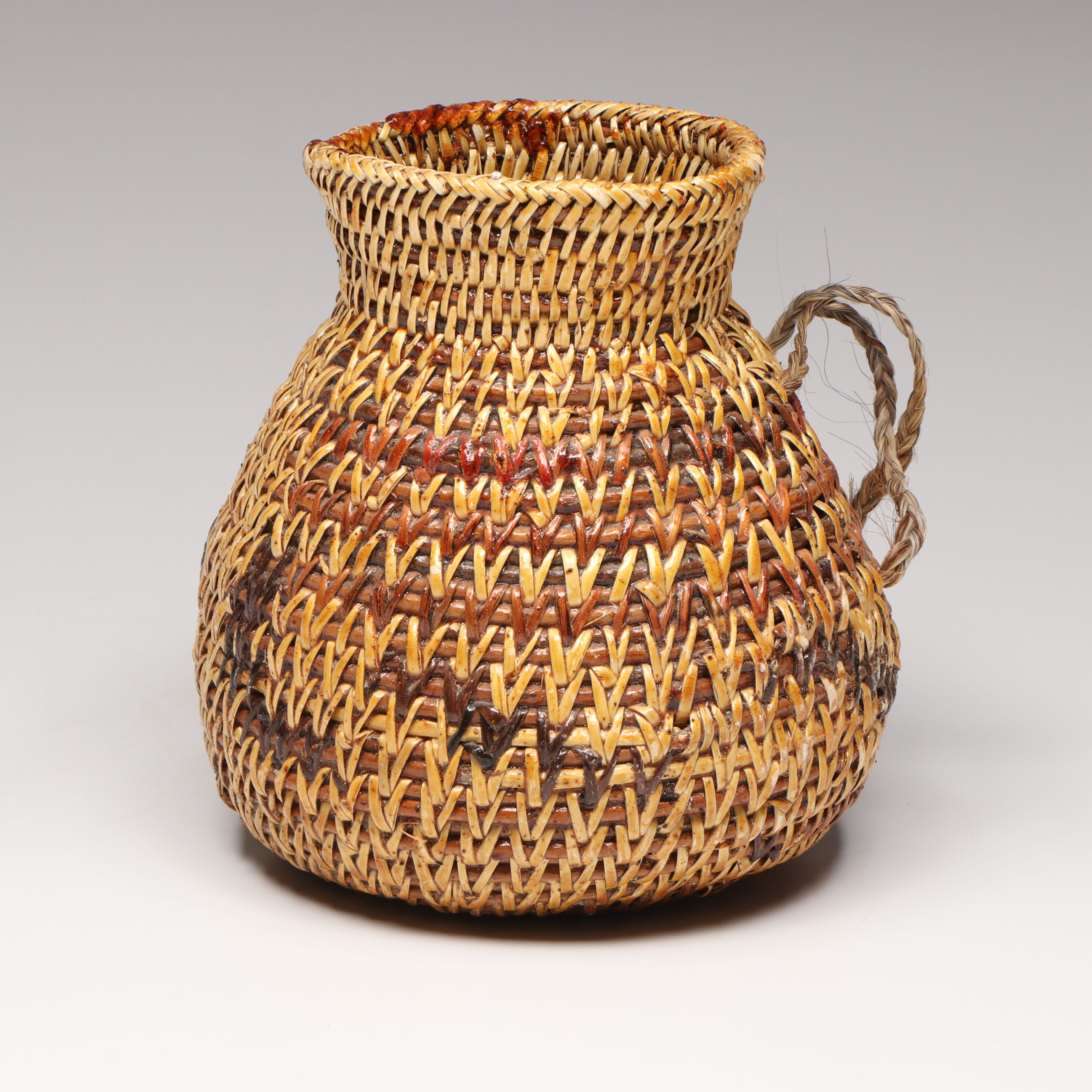 Etta Rock with Other Diné (Navajo) Sumac and Pine Pitch Vessels