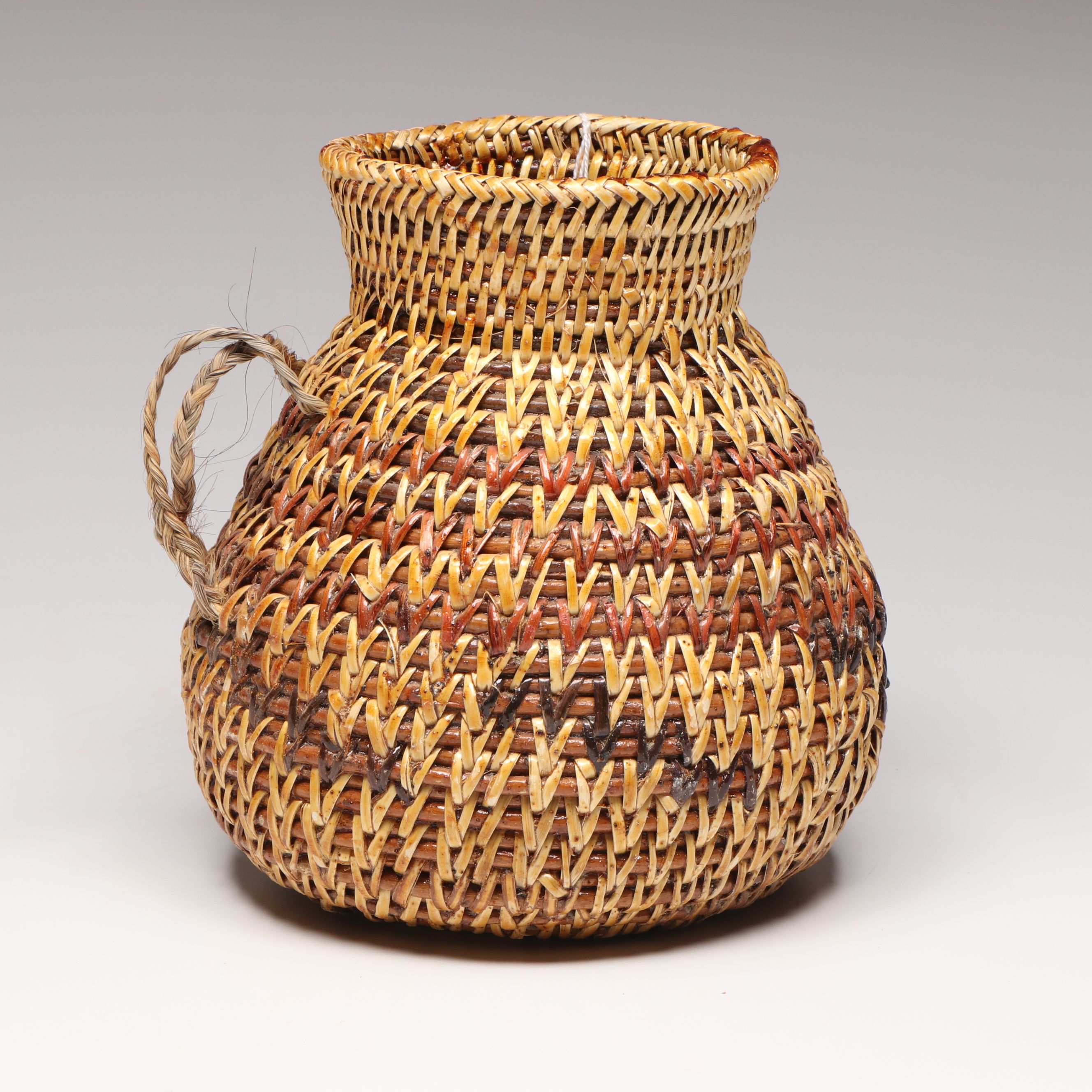 Etta Rock with Other Diné (Navajo) Sumac and Pine Pitch Vessels