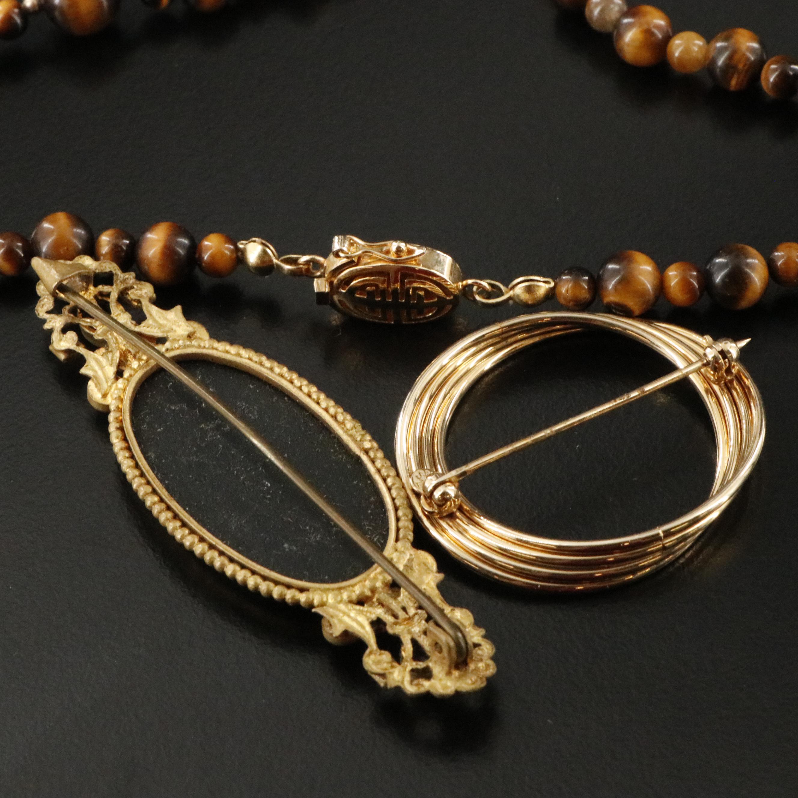 Bakelite, Agate and Tiger's Eye Featured in Jewelry Collection