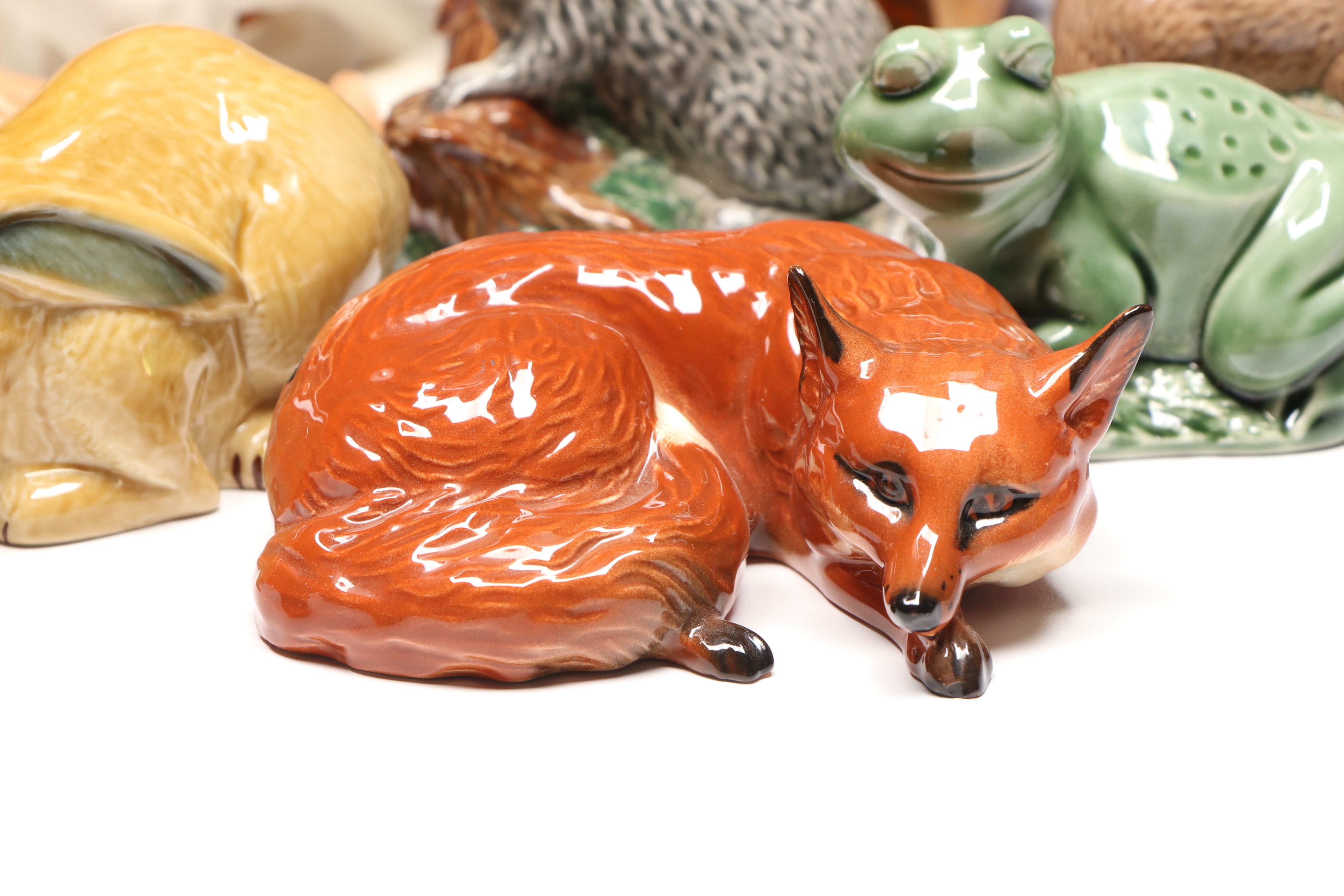 Lomonosov Porcelain Raccoon with Beswick Decanters and More Figurines