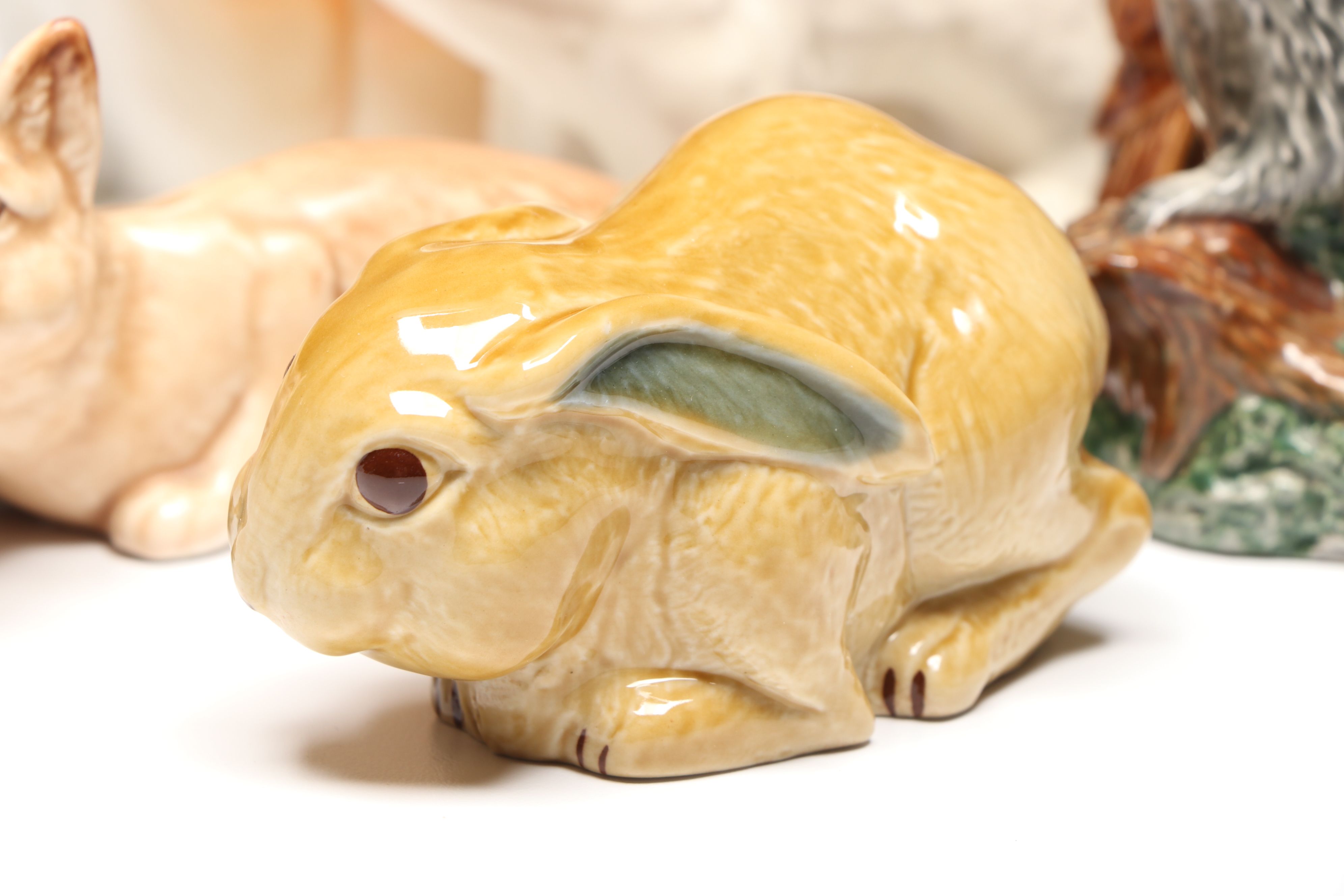 Lomonosov Porcelain Raccoon with Beswick Decanters and More Figurines