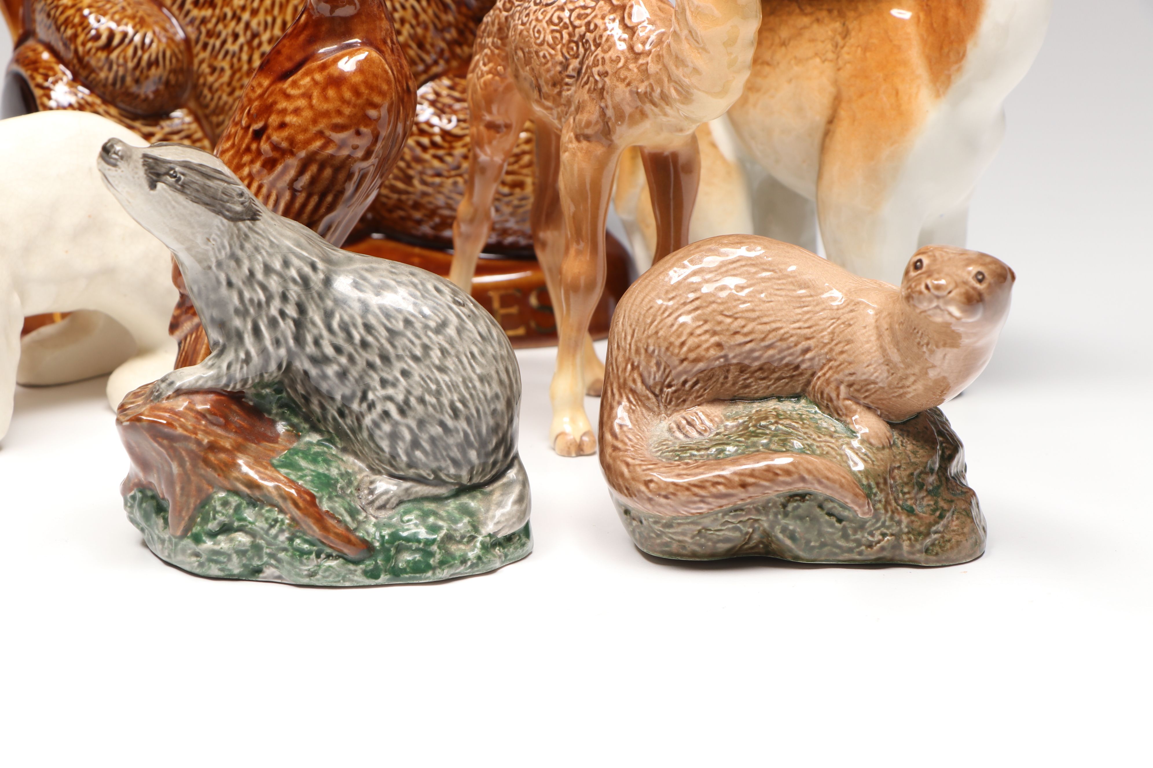 Lomonosov Porcelain Raccoon with Beswick Decanters and More Figurines