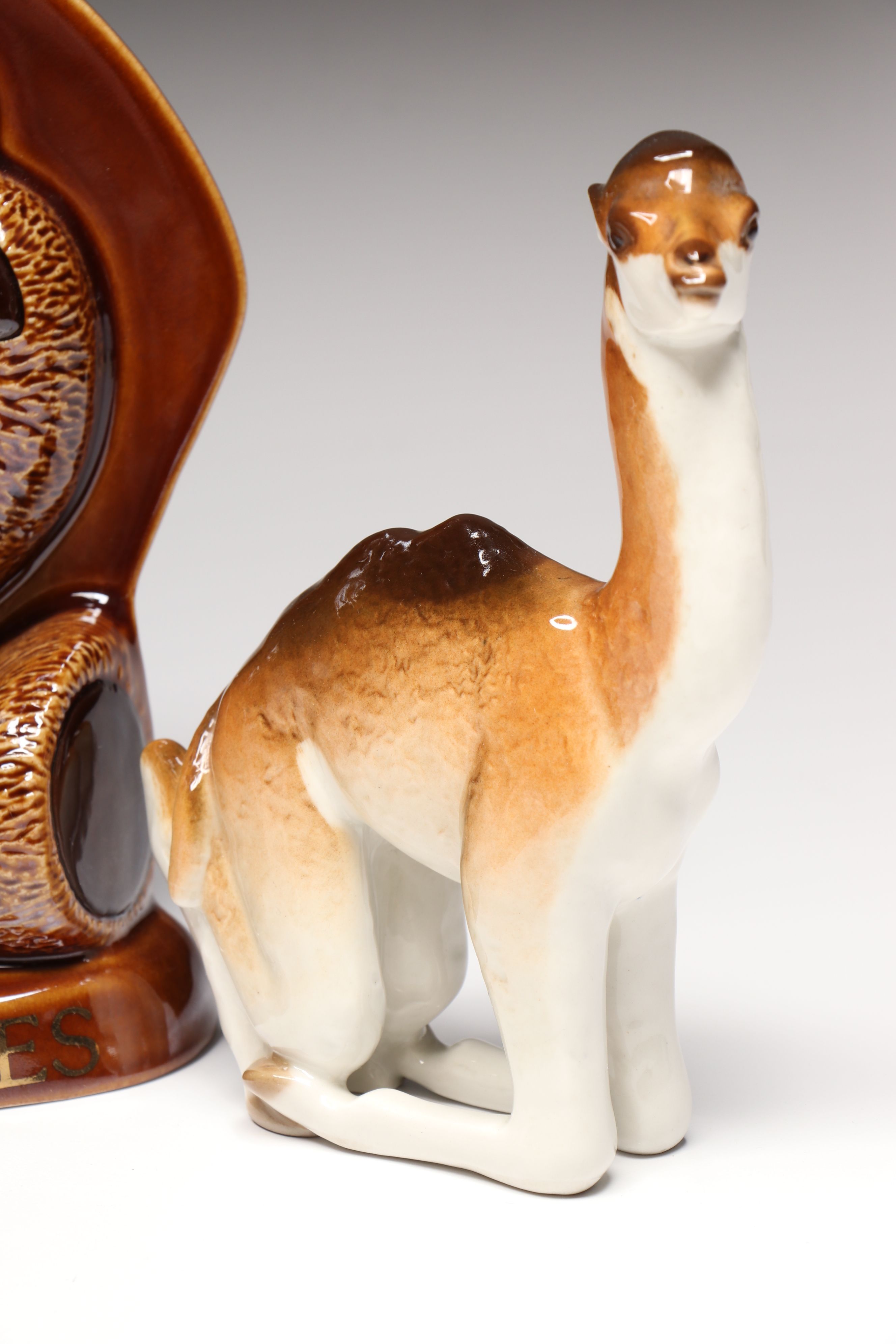 Lomonosov Porcelain Raccoon with Beswick Decanters and More Figurines