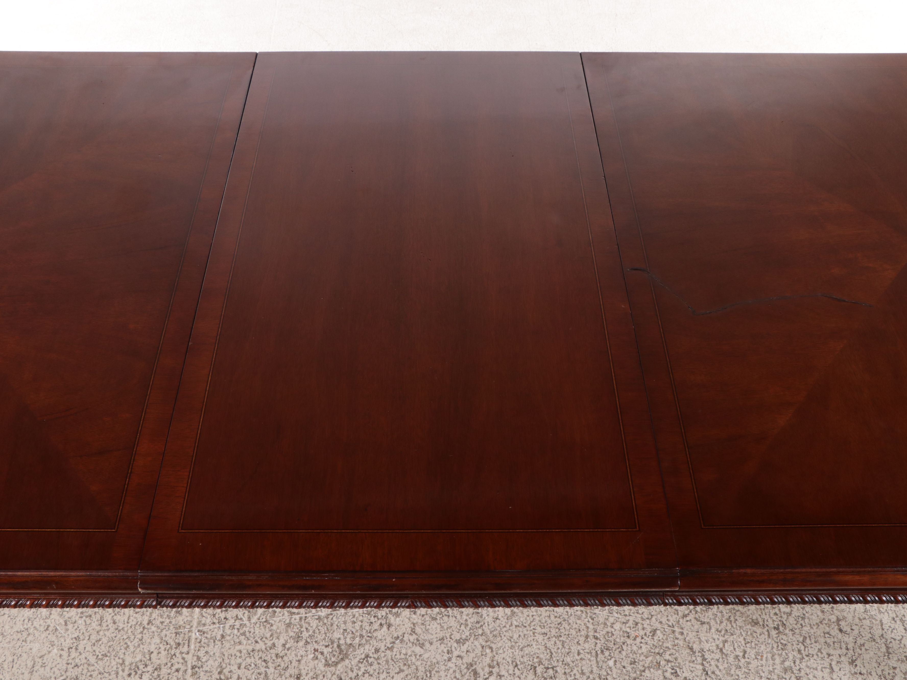 Chippendale Style Sting-Inlaid Mahogany Dining Table and Eight Chairs