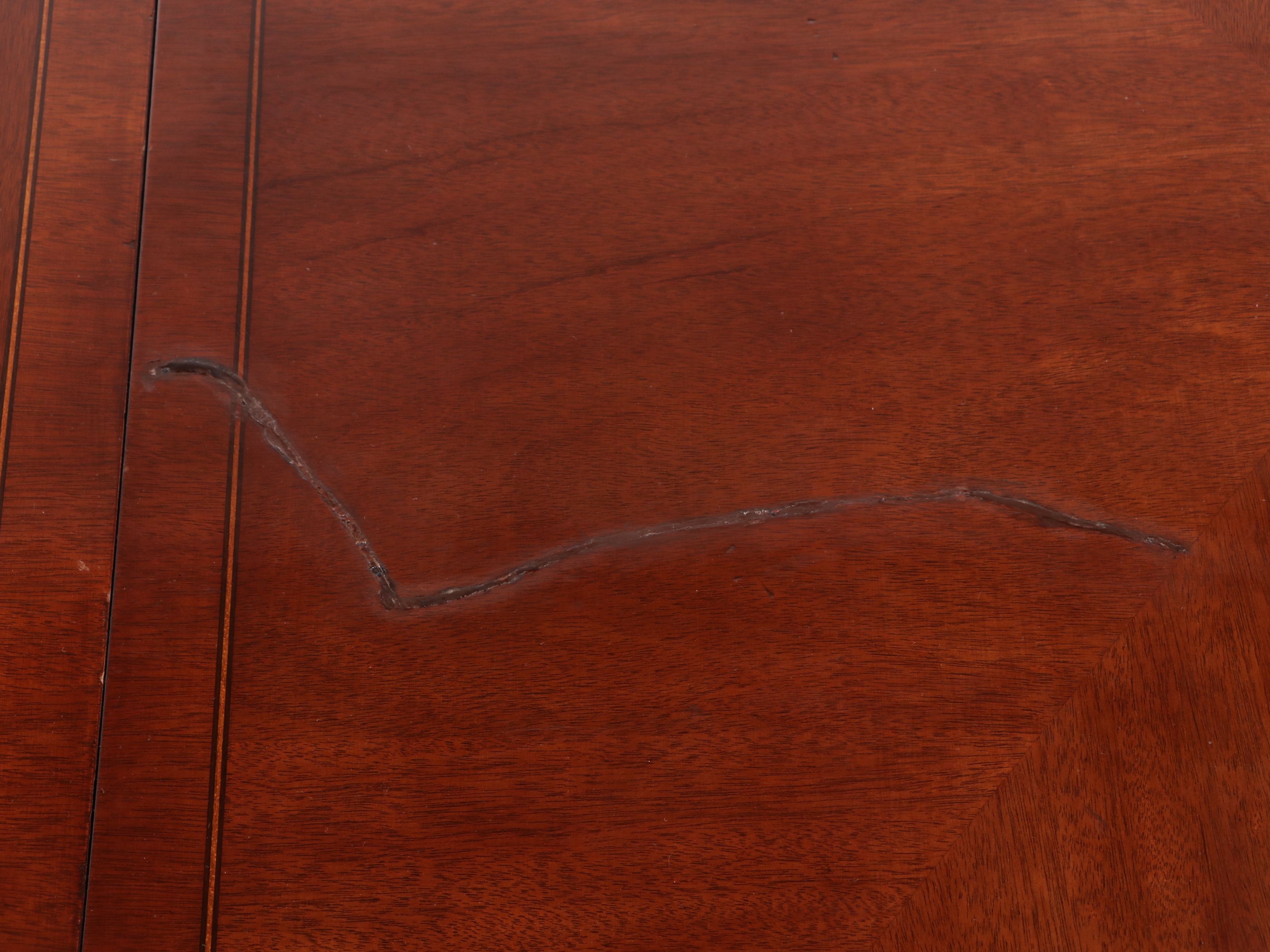 Chippendale Style Sting-Inlaid Mahogany Dining Table and Eight Chairs