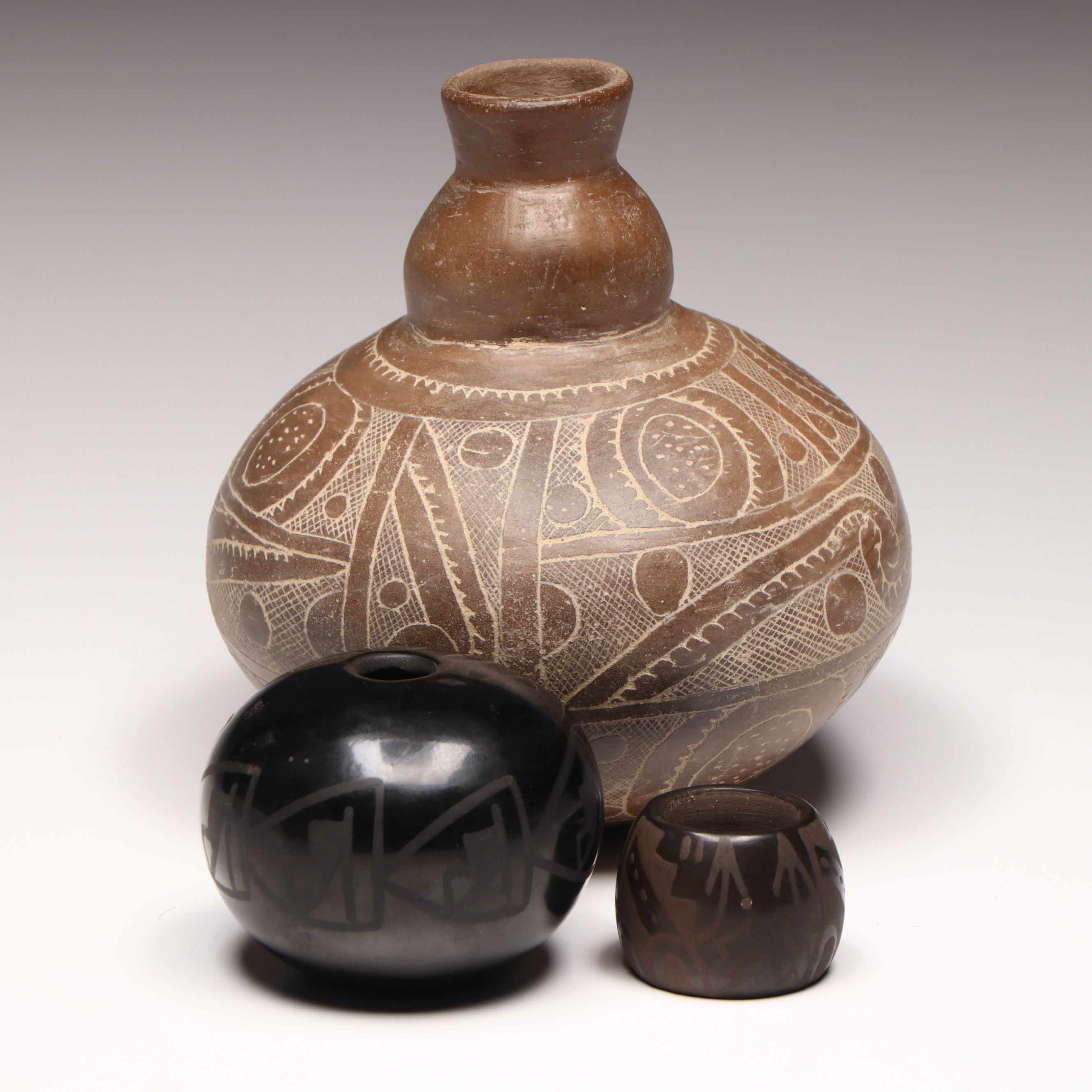 Santa Clara Pueblo with Artist Signed Gourd Shape and More vases