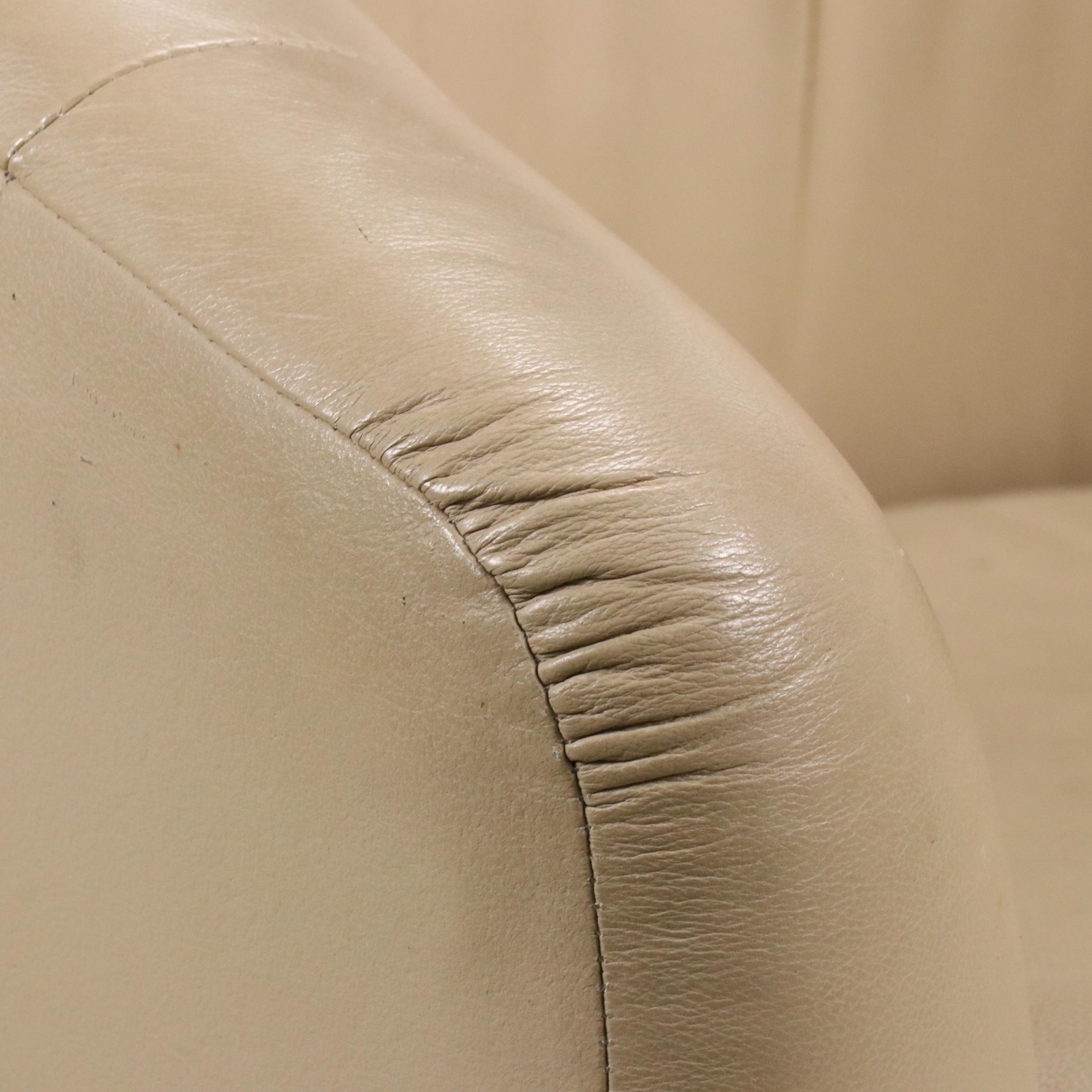 Tan Faux Leather Swivel Armchair