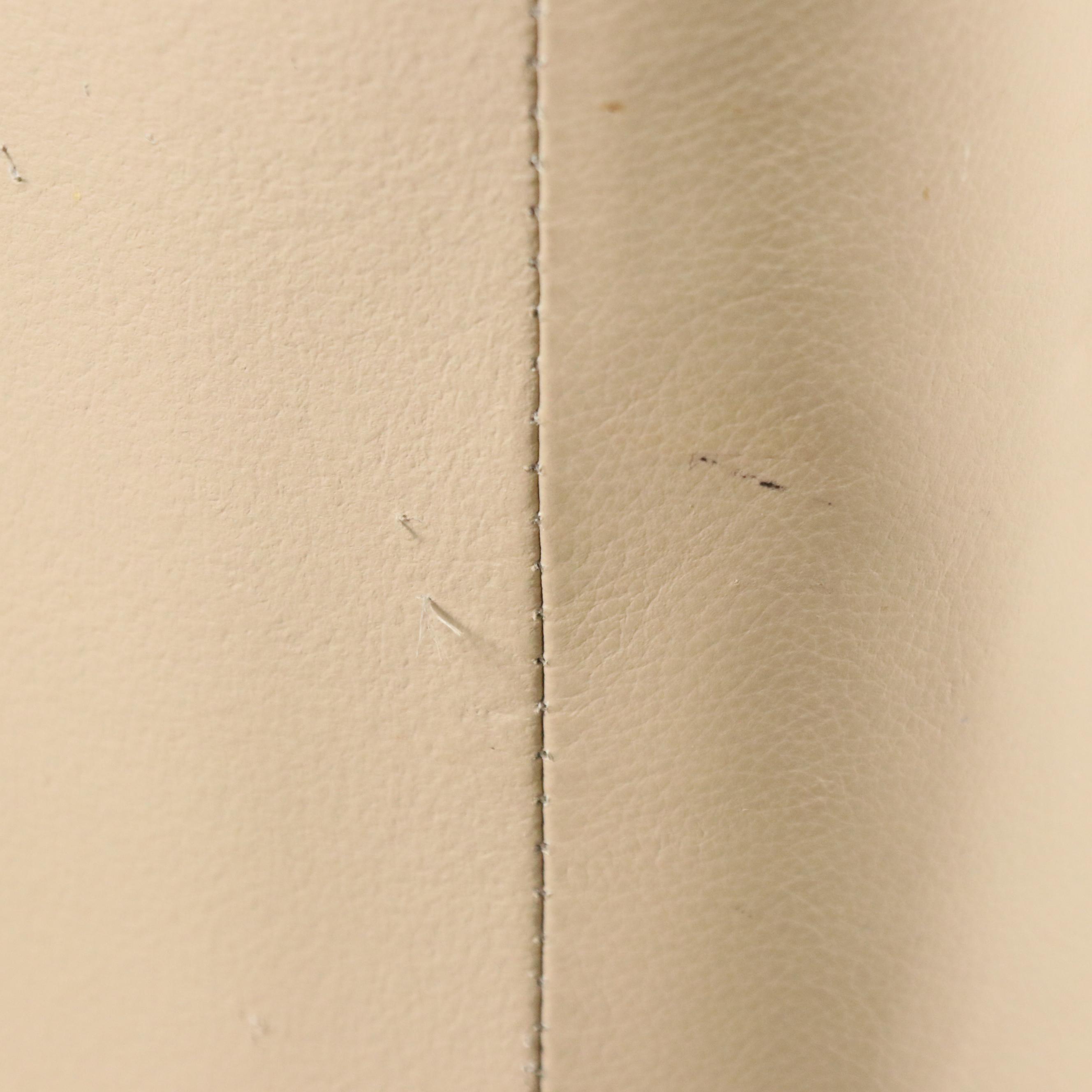 Tan Faux Leather Swivel Armchair