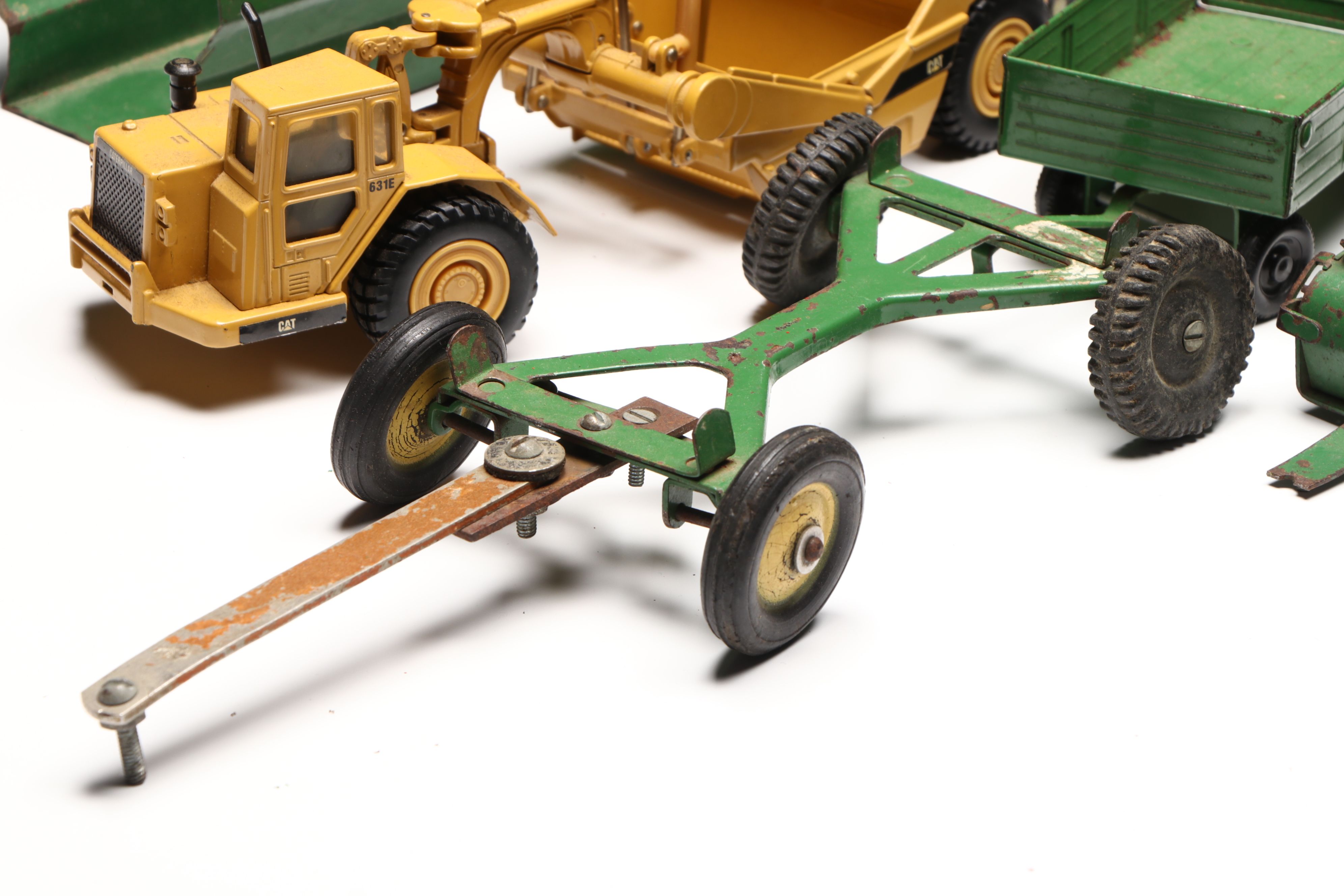 John Deere, Caterpillar, and More Pressed Steel Vintage Farm Vehicle Toys