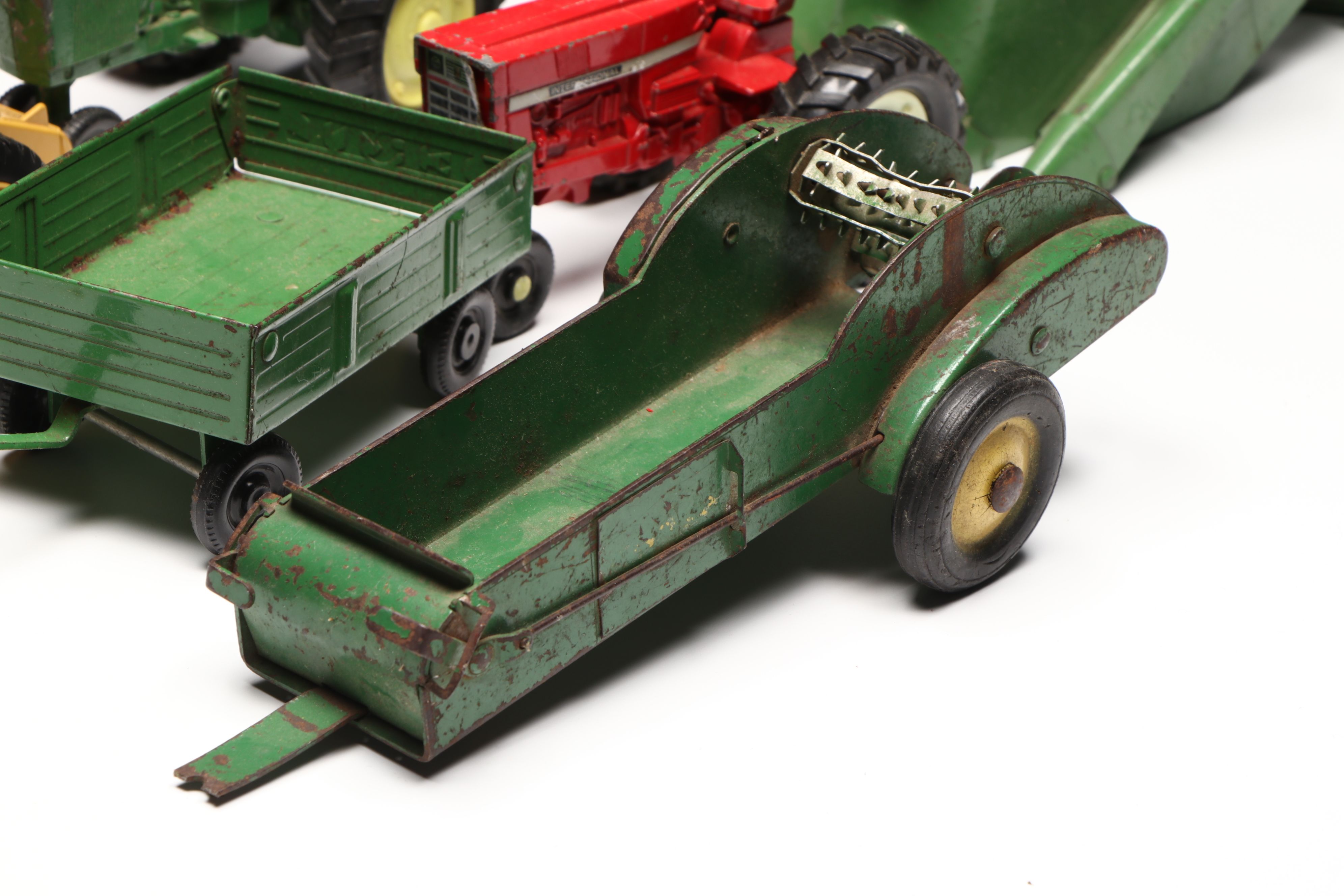 John Deere, Caterpillar, and More Pressed Steel Vintage Farm Vehicle Toys