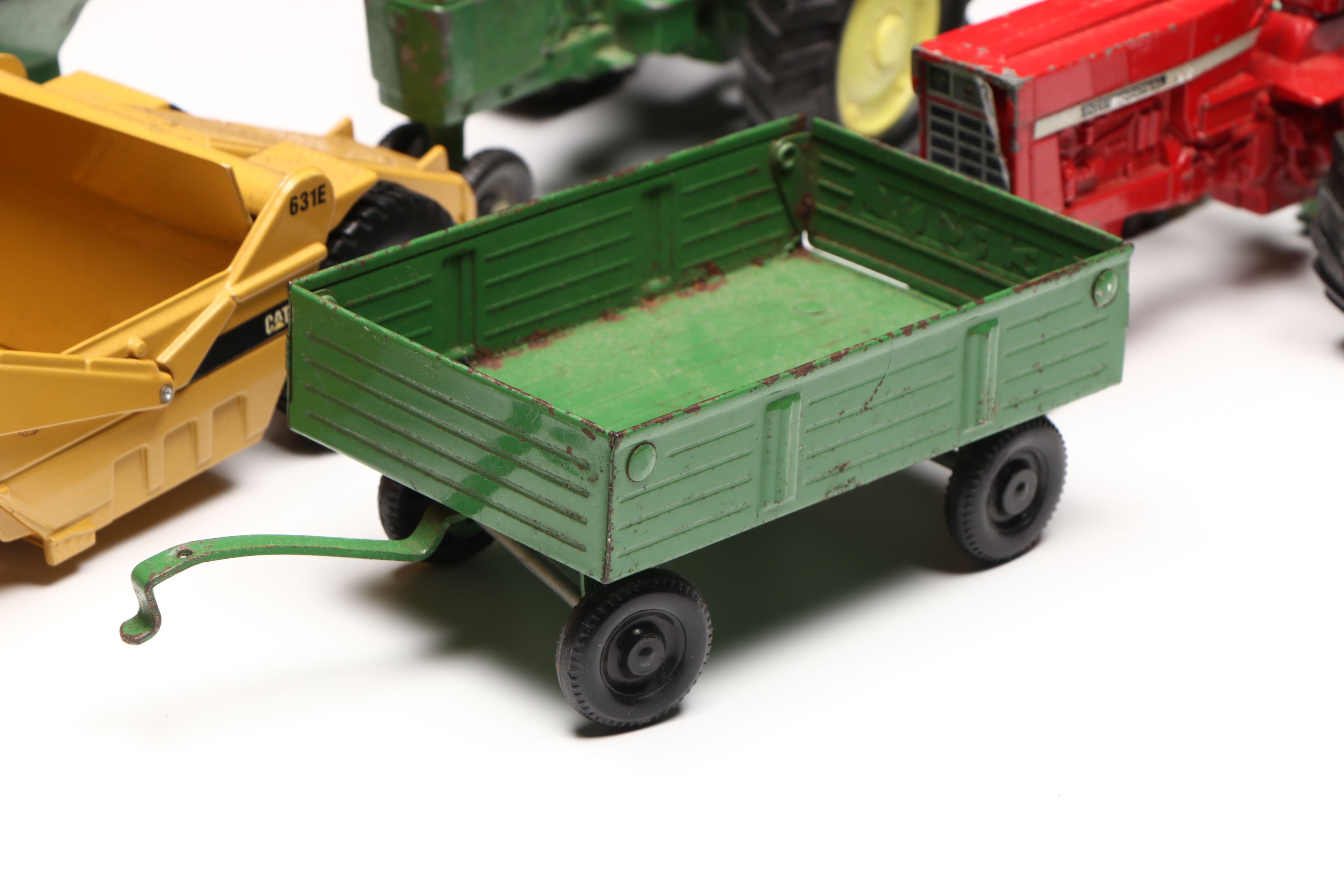John Deere, Caterpillar, and More Pressed Steel Vintage Farm Vehicle Toys