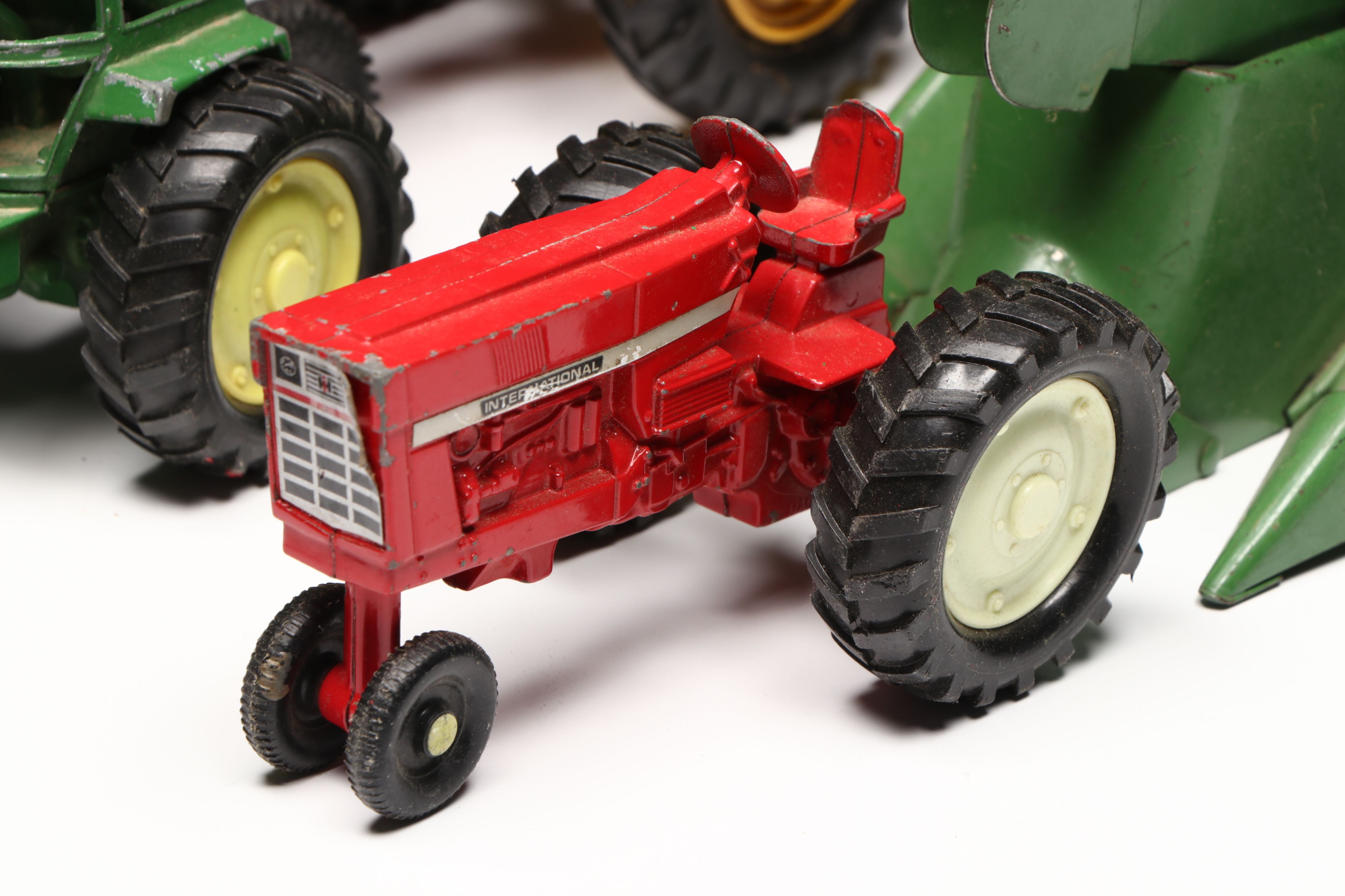 John Deere, Caterpillar, and More Pressed Steel Vintage Farm Vehicle Toys