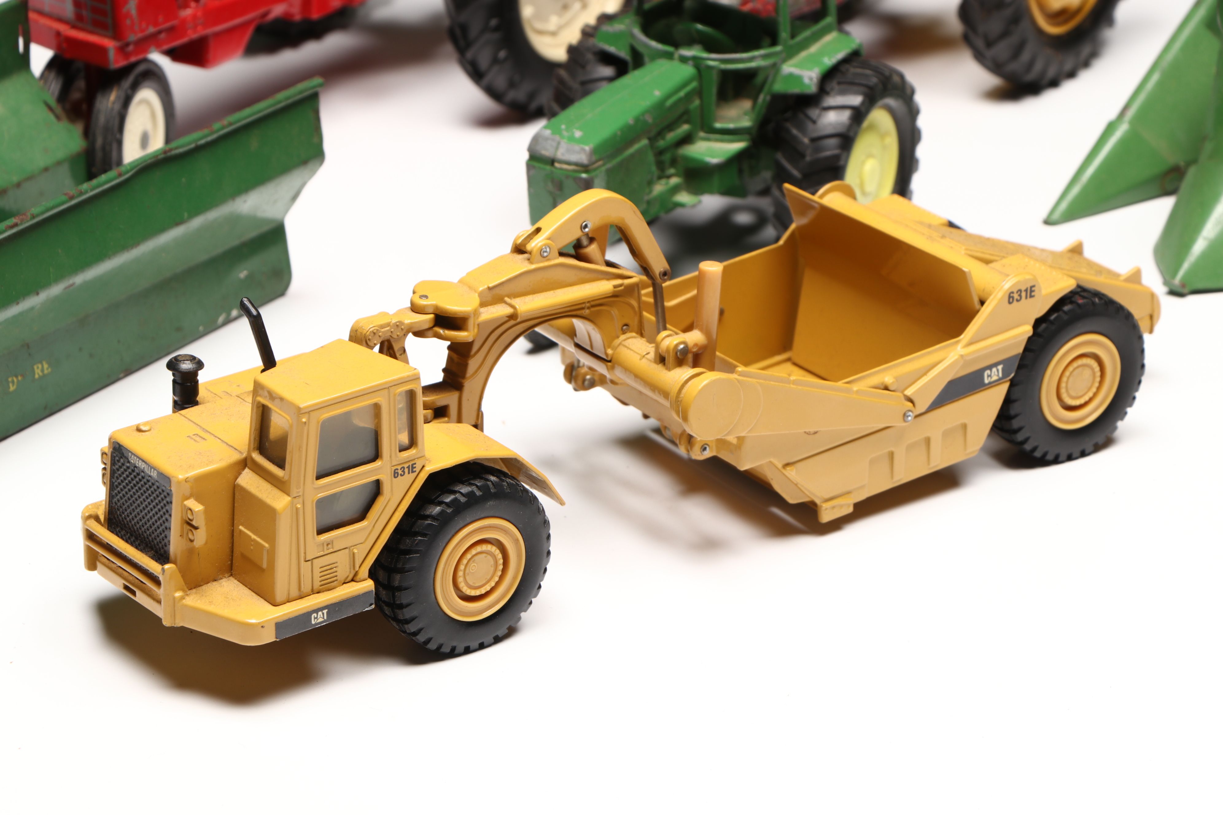 John Deere, Caterpillar, and More Pressed Steel Vintage Farm Vehicle Toys