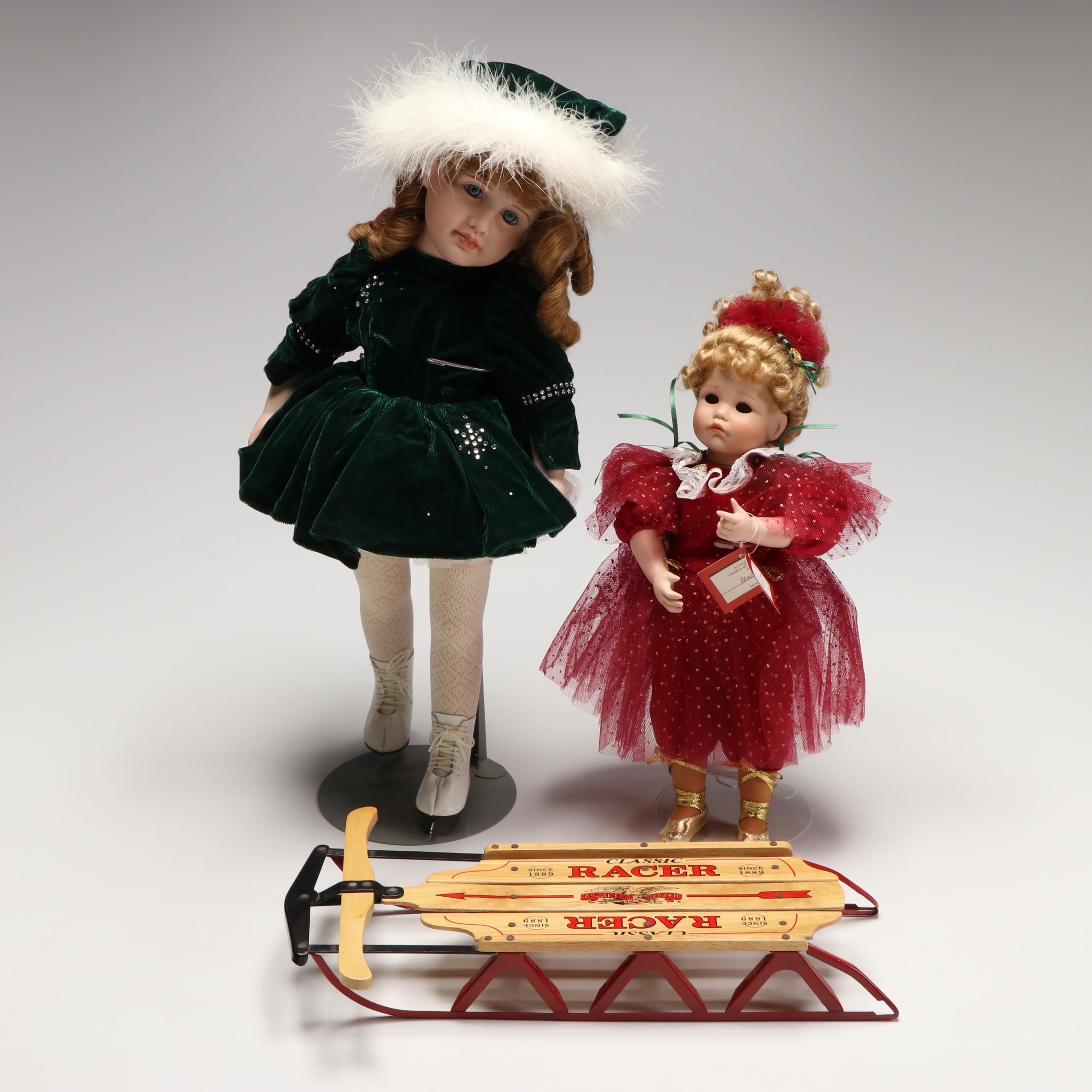 "Dance of the Sugar Plum Fairy" and "Natacha" Porcelain Dolls with Wooden Sled