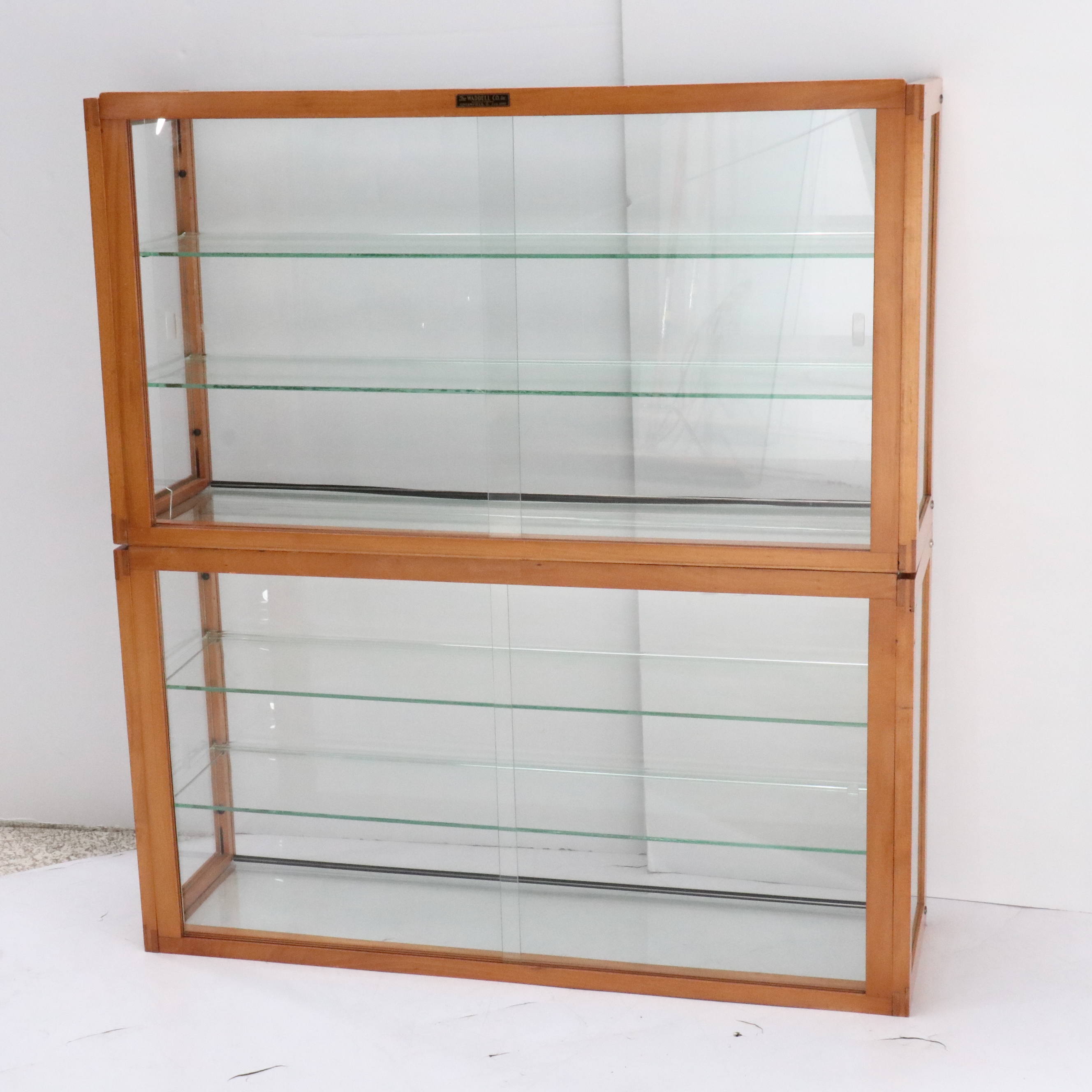 The Waddell Co. Art Deco Style Wood and Glass Display Cabinets