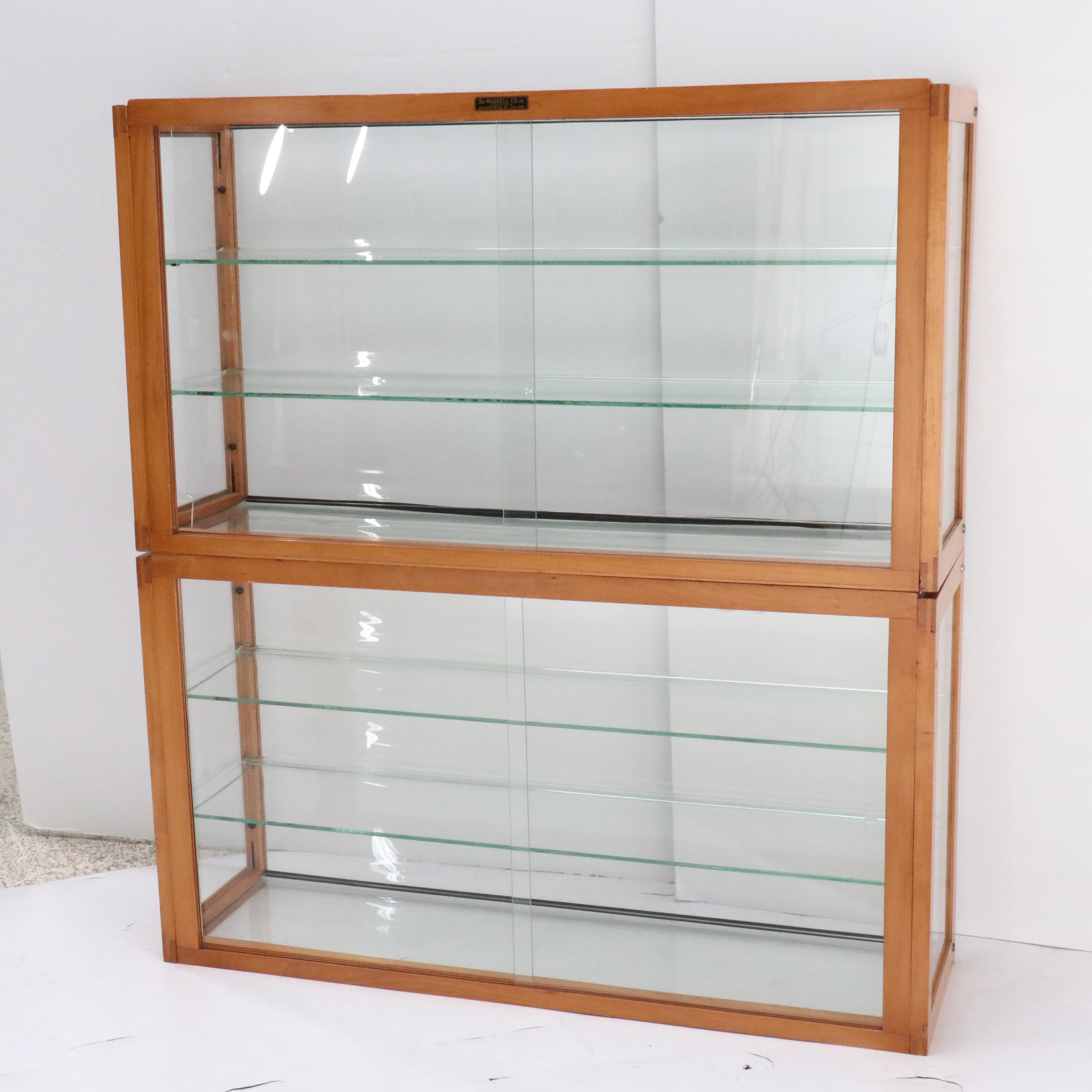 The Waddell Co. Art Deco Style Wood and Glass Display Cabinets
