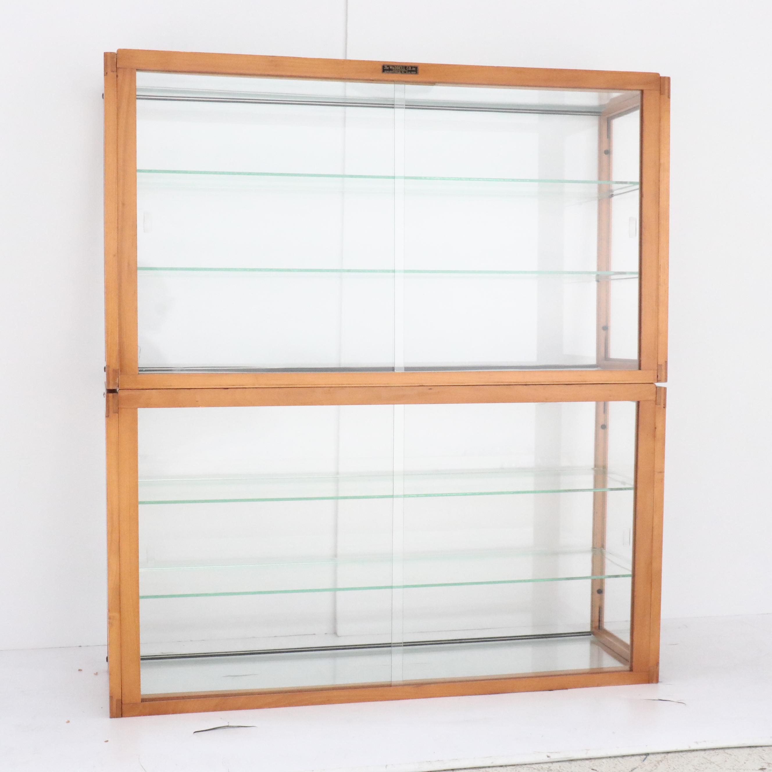 The Waddell Co. Art Deco Style Wood and Glass Display Cabinets