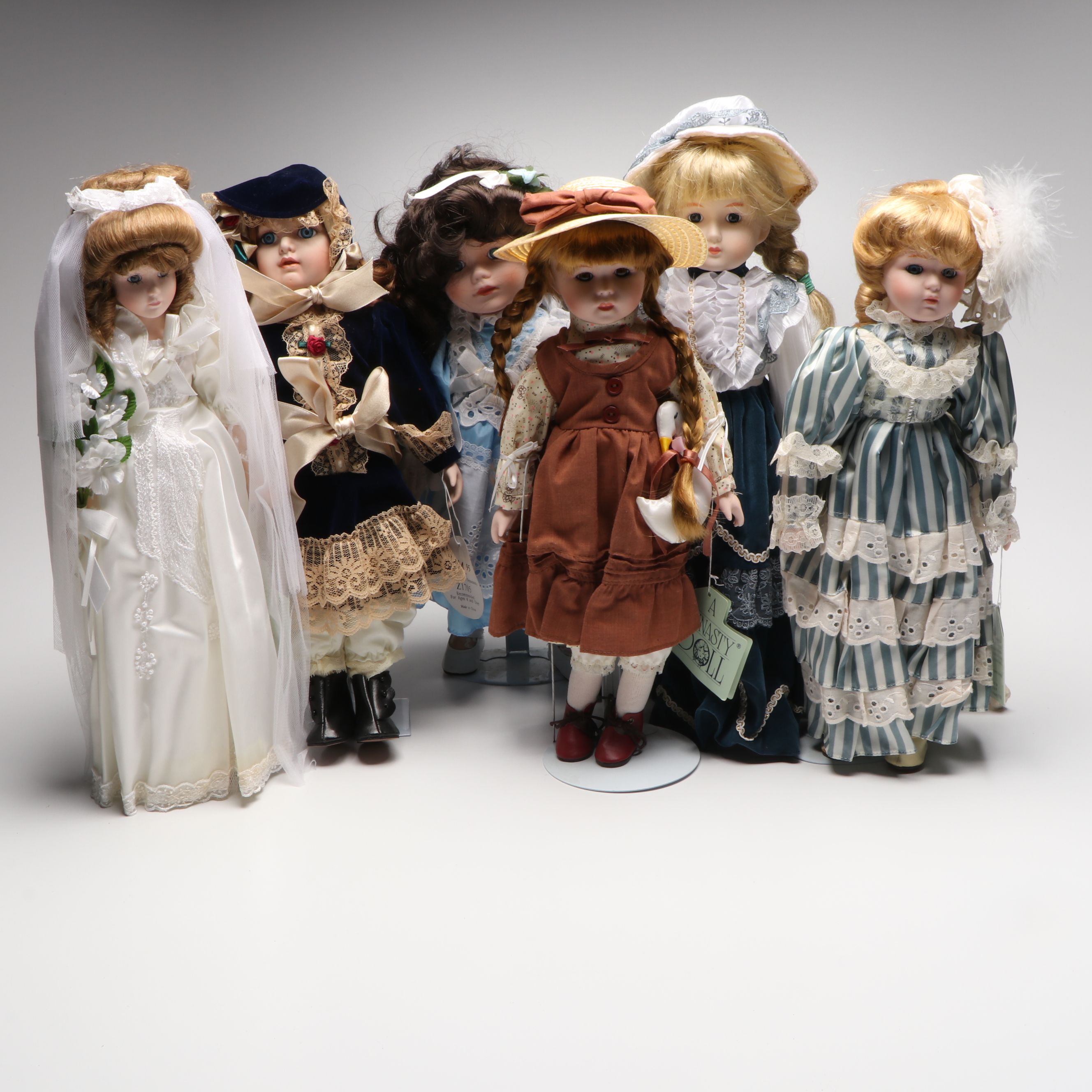 Victorian Style Geppeddo and Other Clothed Bisque Dolls