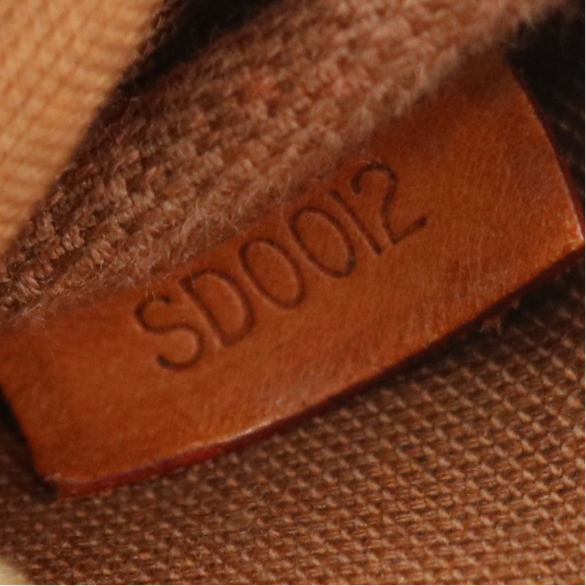 Louis Vuitton Zip Pochette in Monogram Canvas and Vachetta Leather Trim