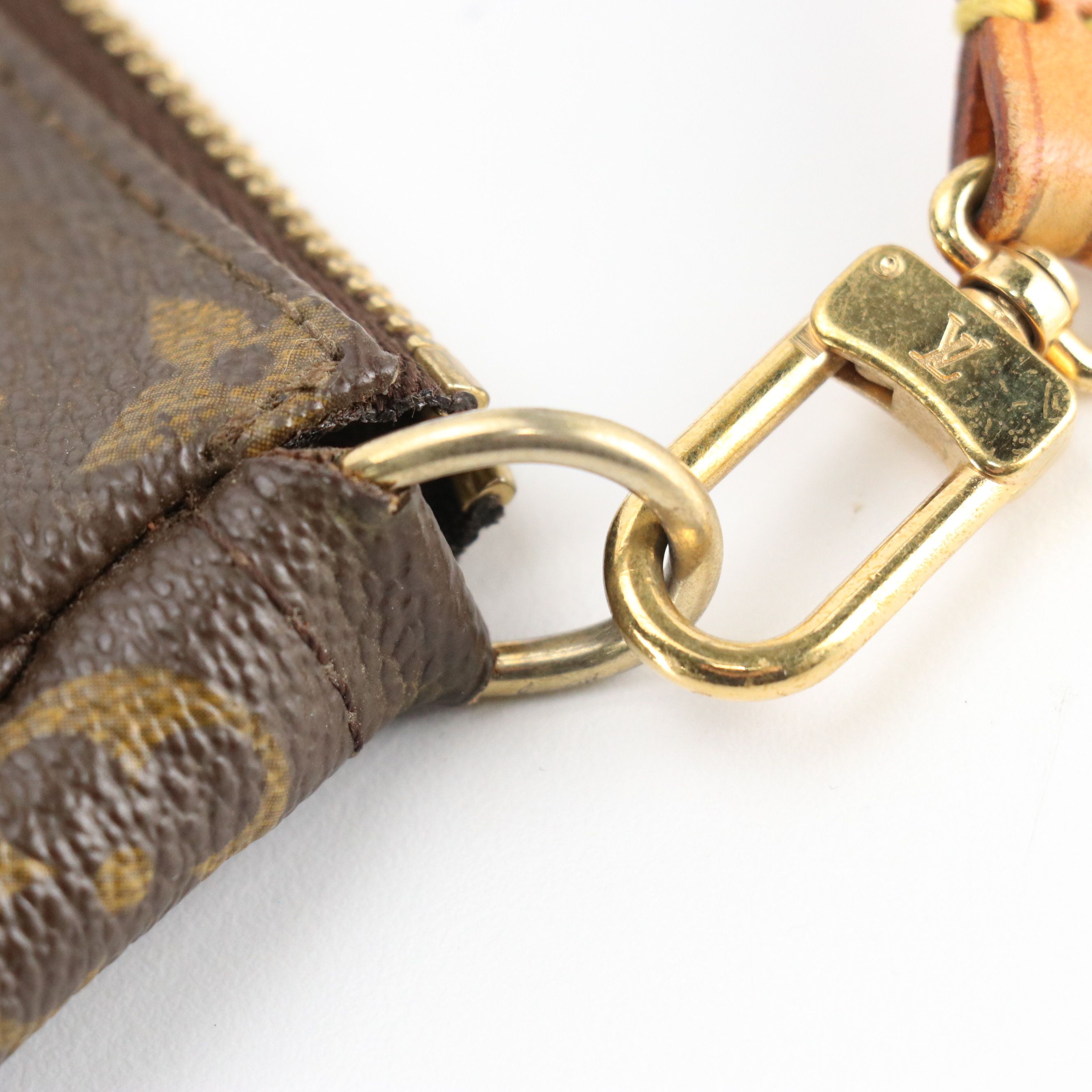 Louis Vuitton Zip Pochette in Monogram Canvas and Vachetta Leather Trim