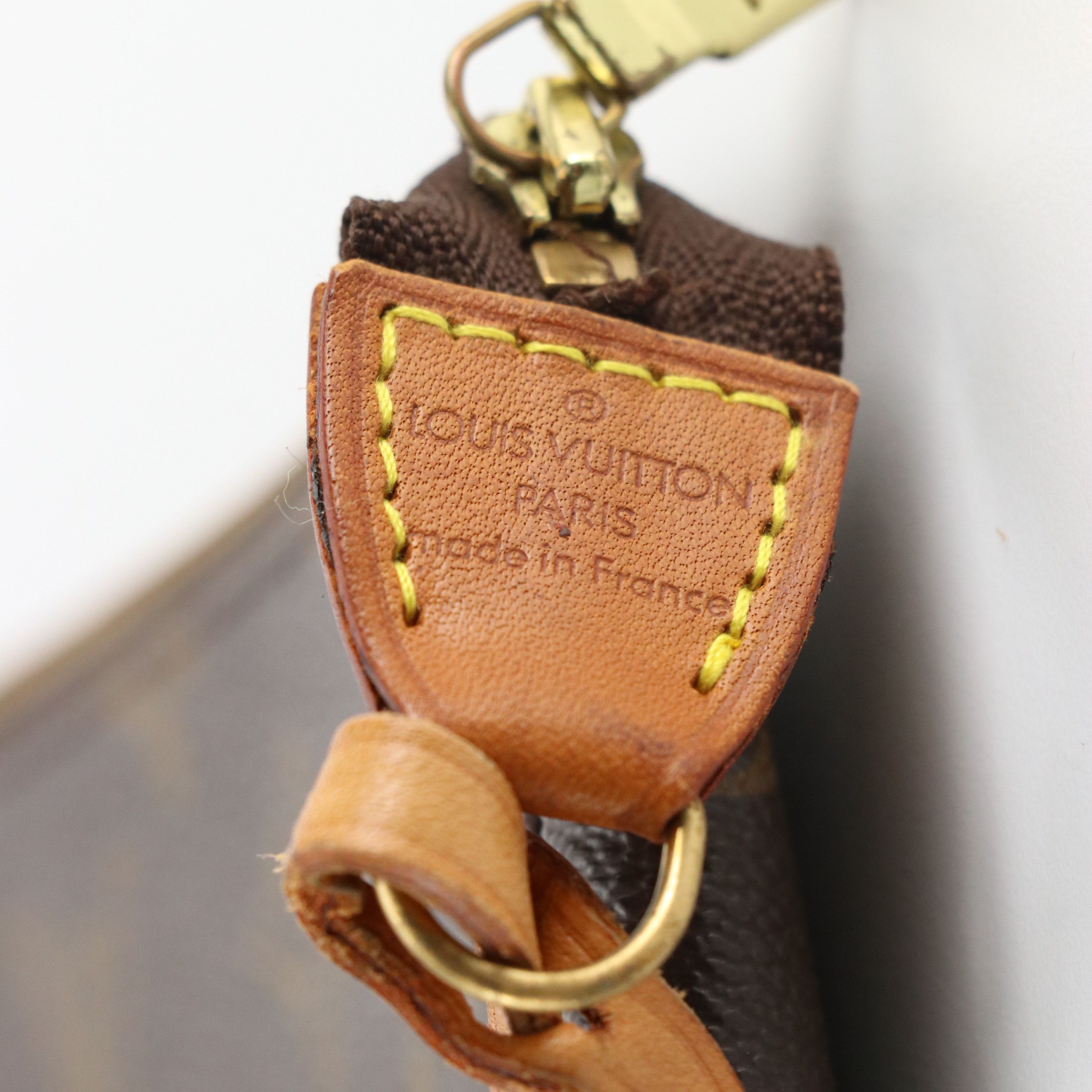 Louis Vuitton Zip Pochette in Monogram Canvas and Vachetta Leather Trim