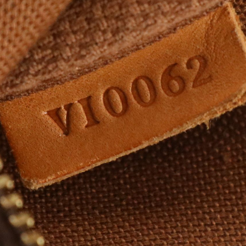 Louis Vuitton Zip Pochette in Monogram Canvas and Vachetta Leather Trim