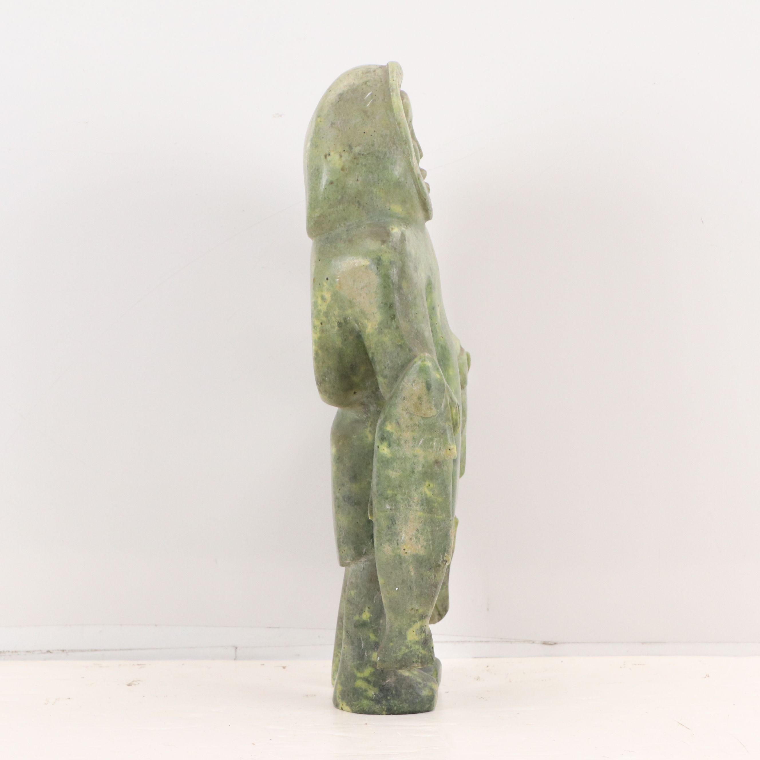 Carved Serpentine Sculpture of Inuit Hunter with Fish, Mid-20th Century