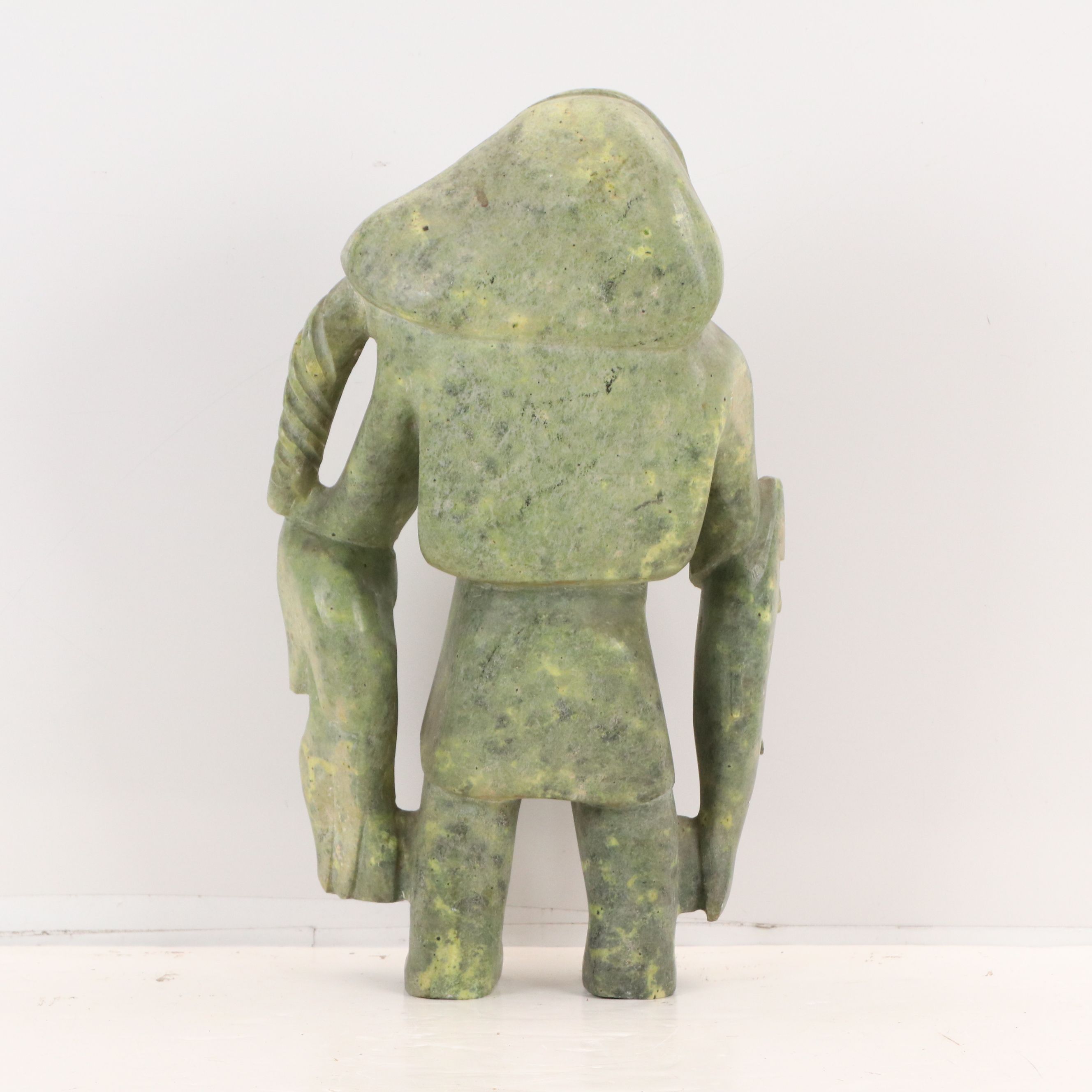 Carved Serpentine Sculpture of Inuit Hunter with Fish, Mid-20th Century