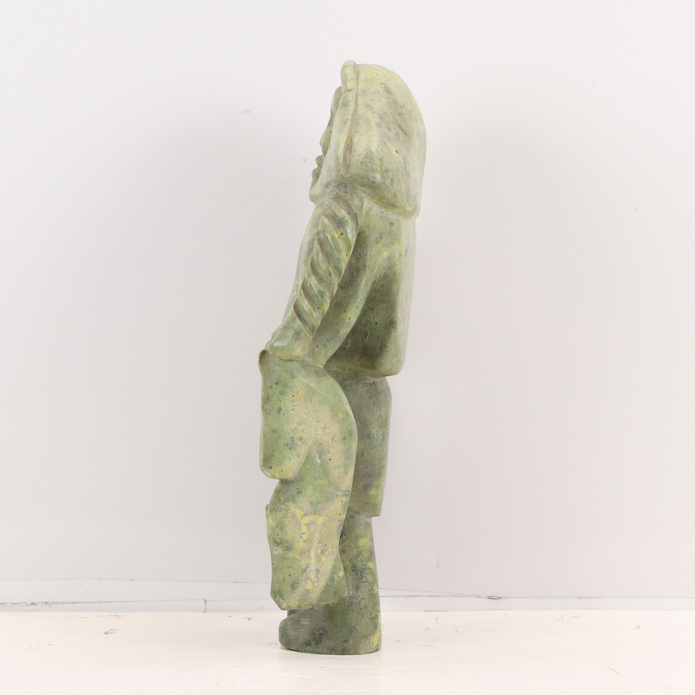 Carved Serpentine Sculpture of Inuit Hunter with Fish, Mid-20th Century