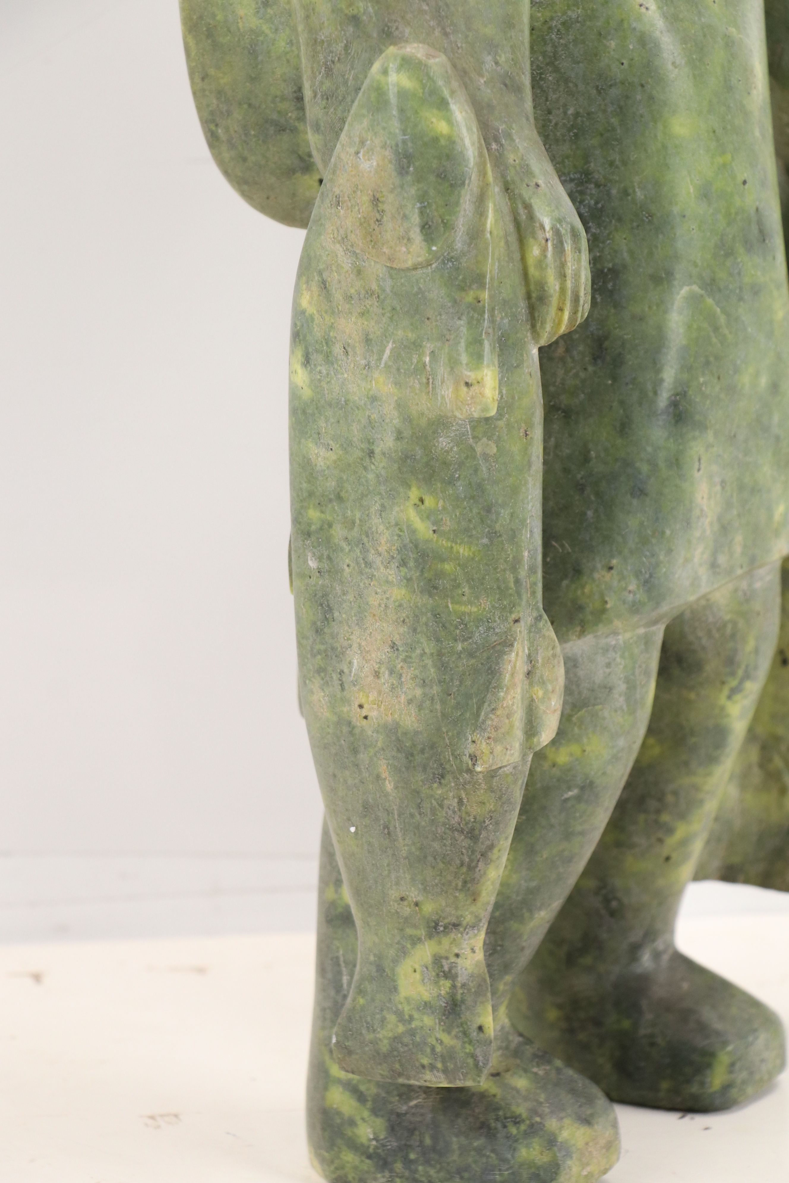 Carved Serpentine Sculpture of Inuit Hunter with Fish, Mid-20th Century